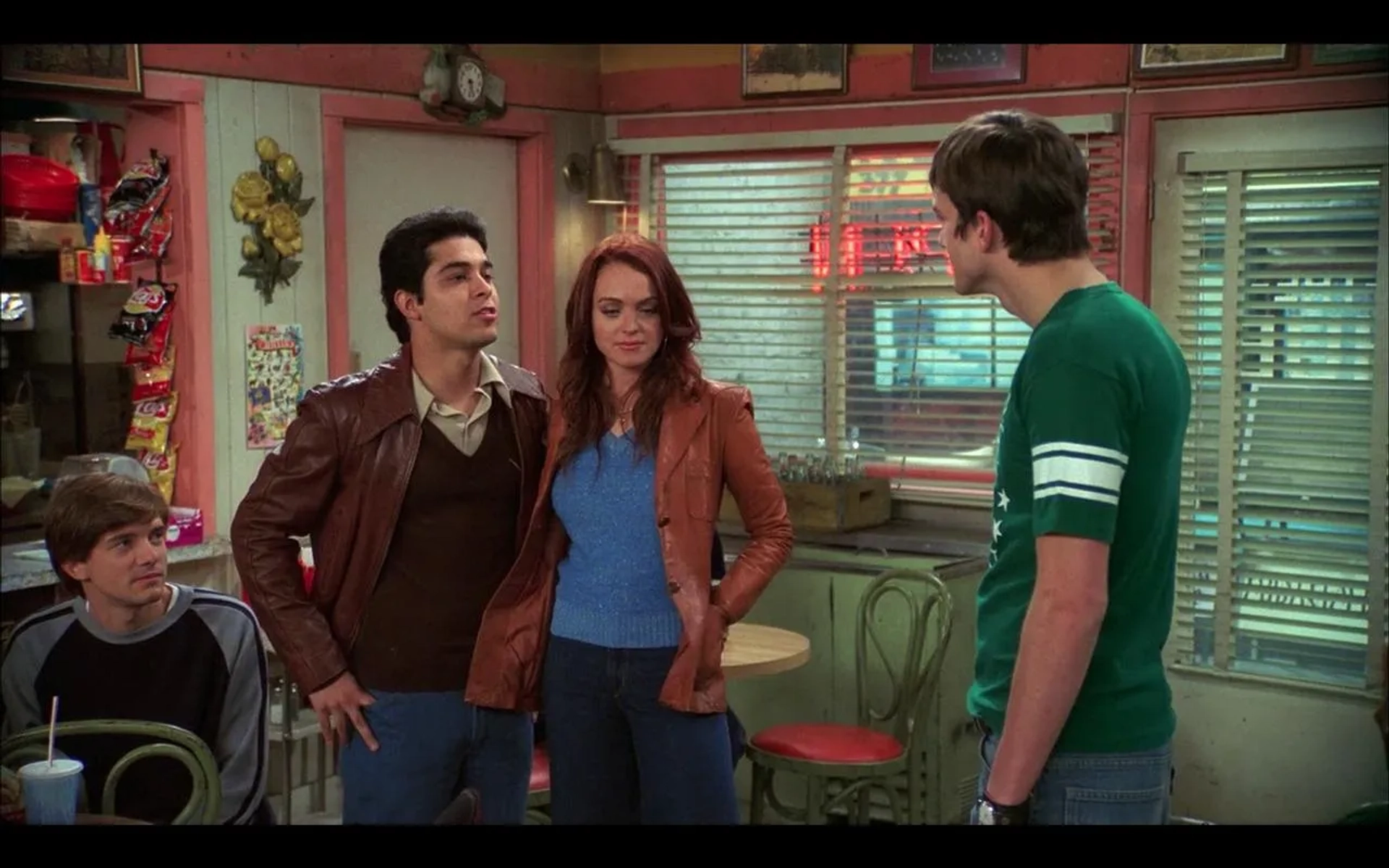 Ashton Kutcher, Wilmer Valderrama, Topher Grace, and Lindsay Lohan in That '70s Show (1998)