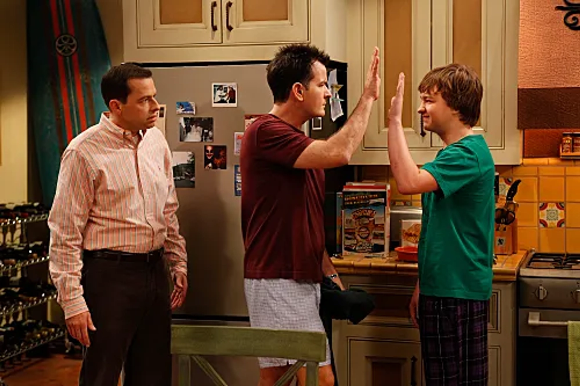 Charlie Sheen, Jon Cryer, and Angus T. Jones in Two and a Half Men (2003)