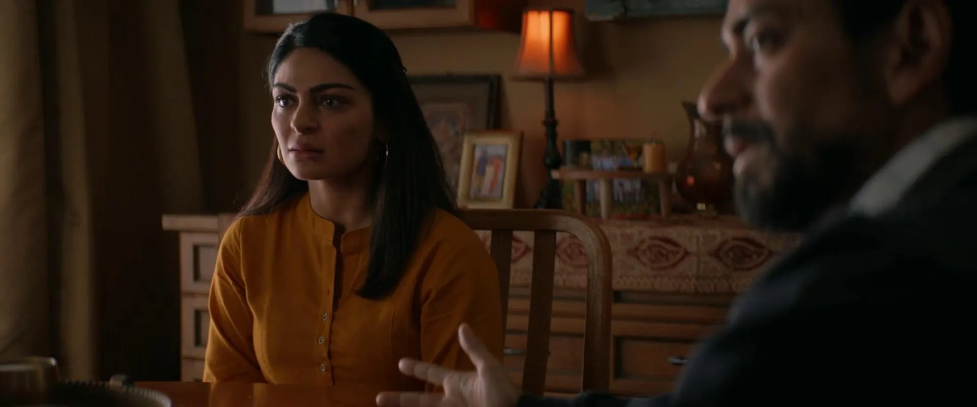 Vik Sahay and Neeru Bajwa in It Lives Inside (2023)