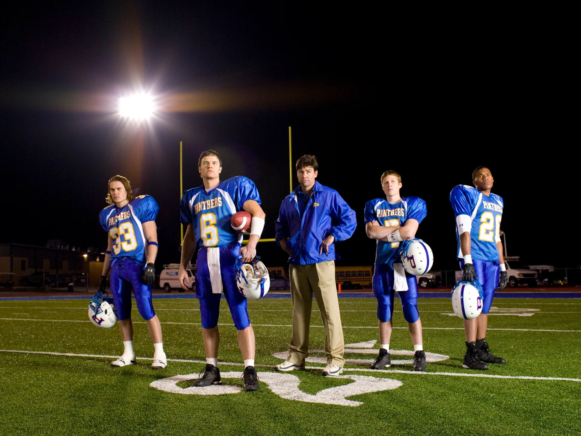 Kyle Chandler, Zach Gilford, Taylor Kitsch, Gaius Charles, and Scott Porter in Friday Night Lights (2006)