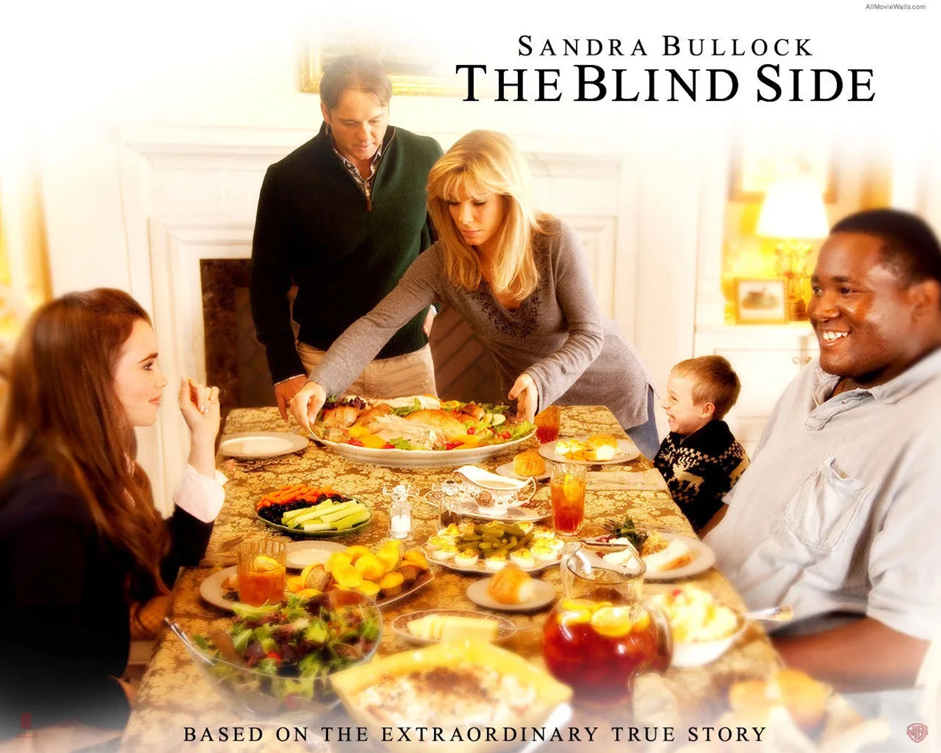 Sandra Bullock, Tim McGraw, Jae Head, Quinton Aaron, and Lily Collins in The Blind Side (2009)