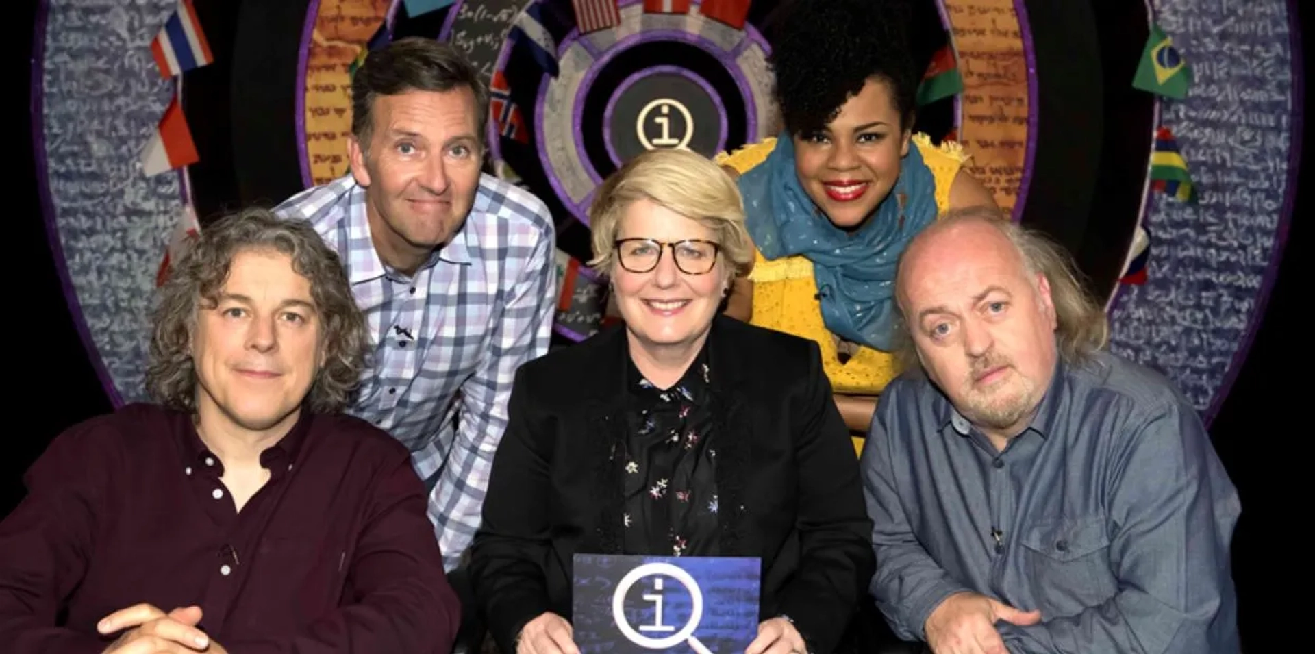 Bill Bailey, Alan Davies, Colin Lane, Sandi Toksvig, and Desiree Burch in QI (2003)