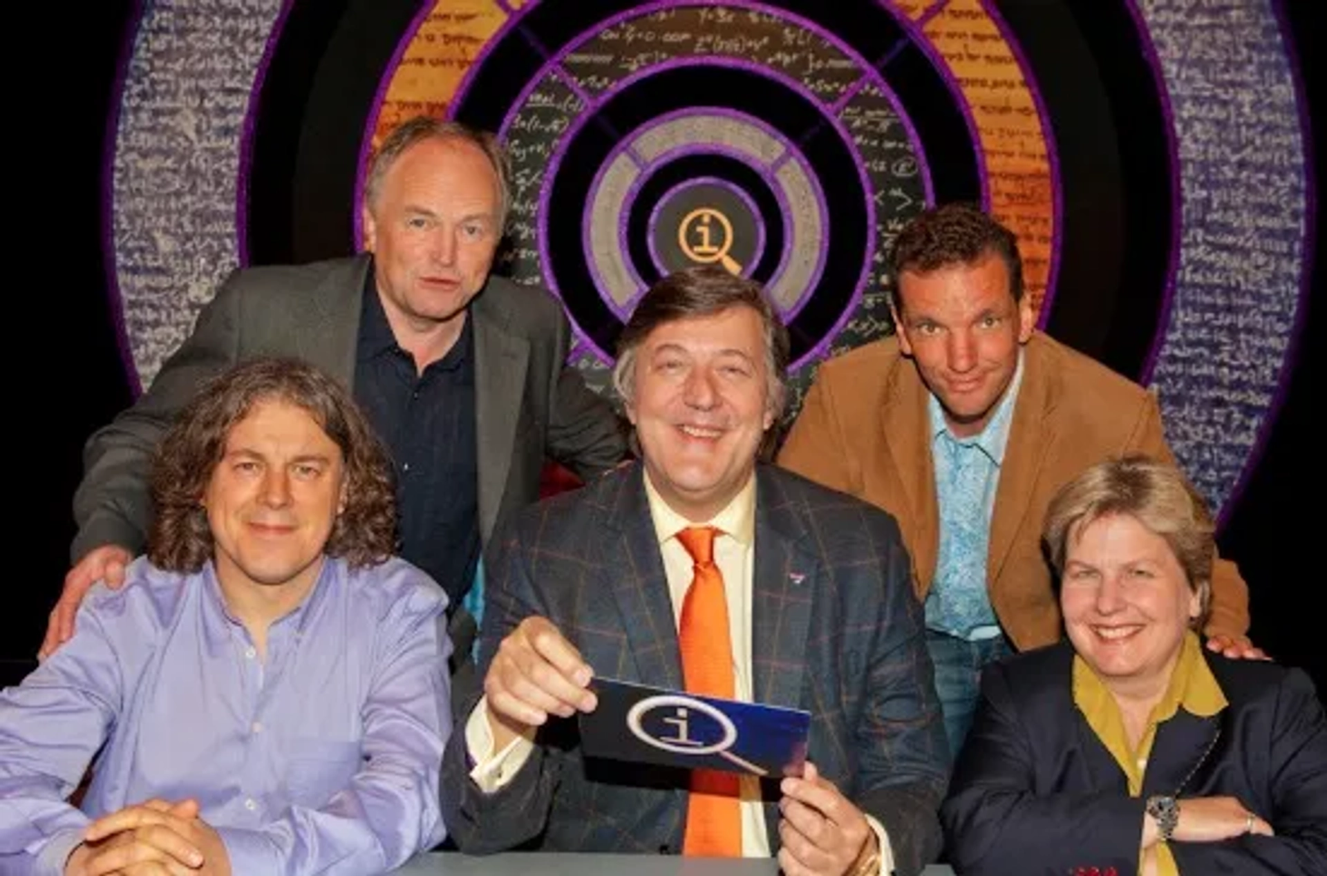 Stephen Fry, Clive Anderson, Alan Davies, Sandi Toksvig, and Henning Wehn in QI (2003)