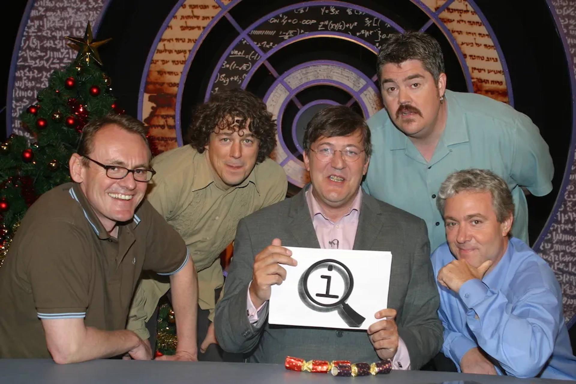 Stephen Fry, Alan Davies, Phill Jupitus, Sean Lock, and John Sessions in QI (2003)