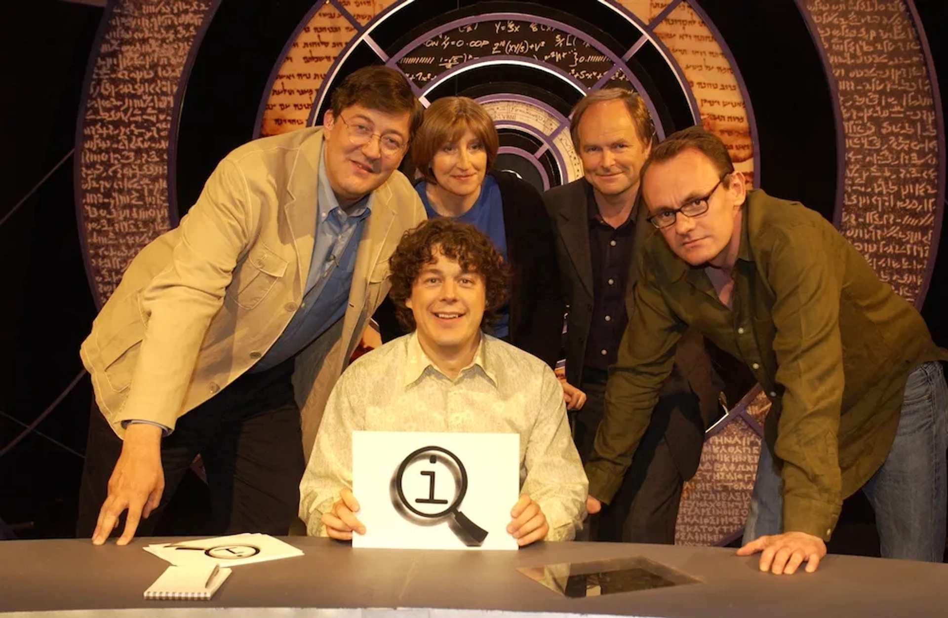 Stephen Fry, Clive Anderson, Alan Davies, Sean Lock, and Linda Smith in QI (2003)