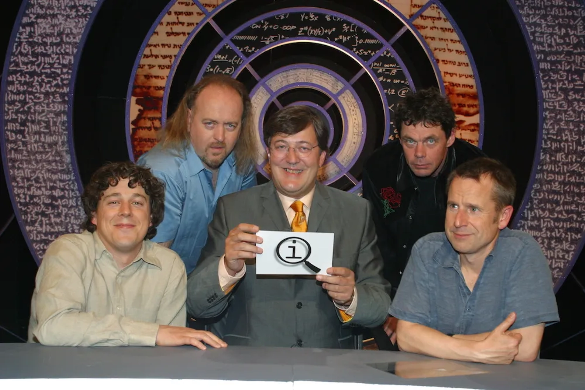 Stephen Fry, Bill Bailey, Alan Davies, Rich Hall, and Jeremy Hardy in QI (2003)