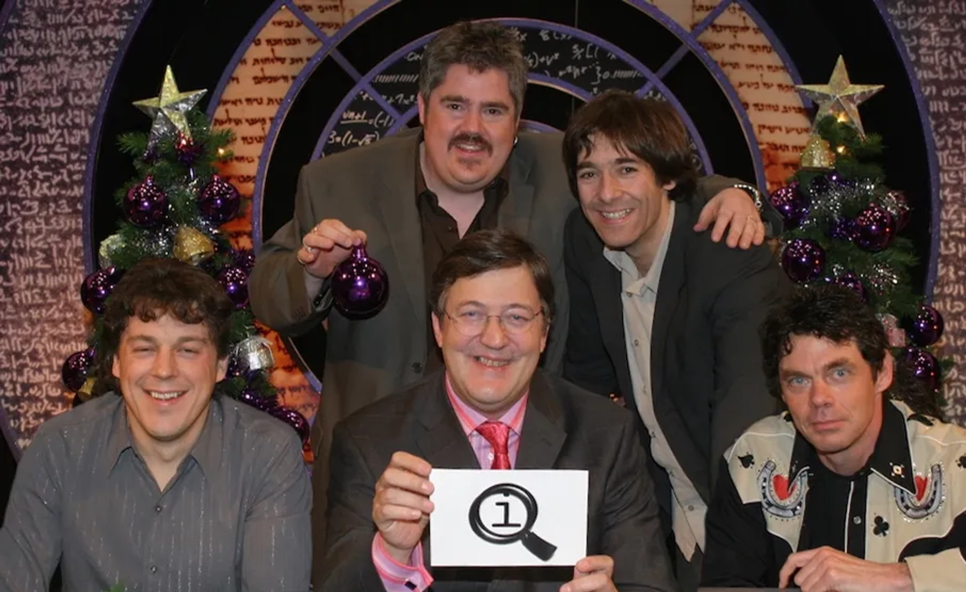 Stephen Fry, Alan Davies, Rich Hall, Phill Jupitus, and Mark Steel in QI (2003)