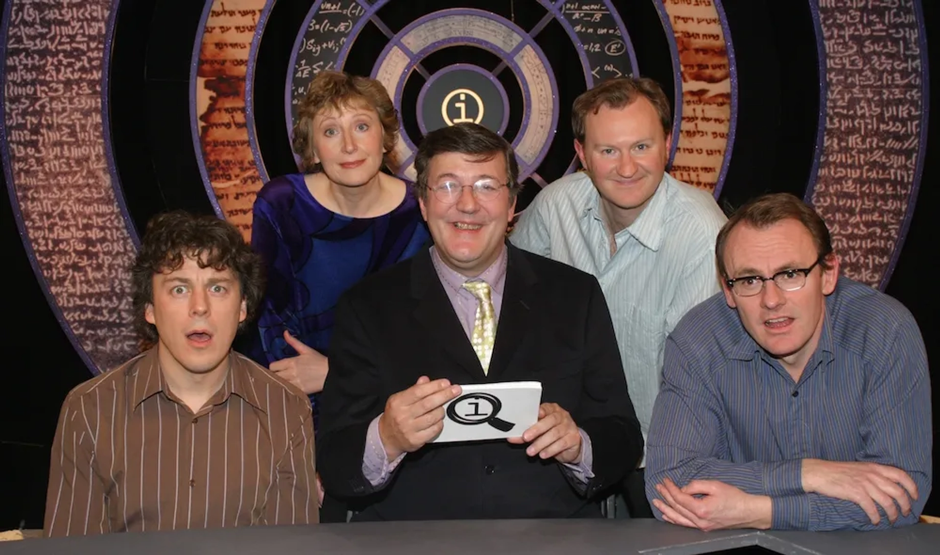 Stephen Fry, Alan Davies, Mark Gatiss, Sean Lock, and Linda Smith in QI (2003)