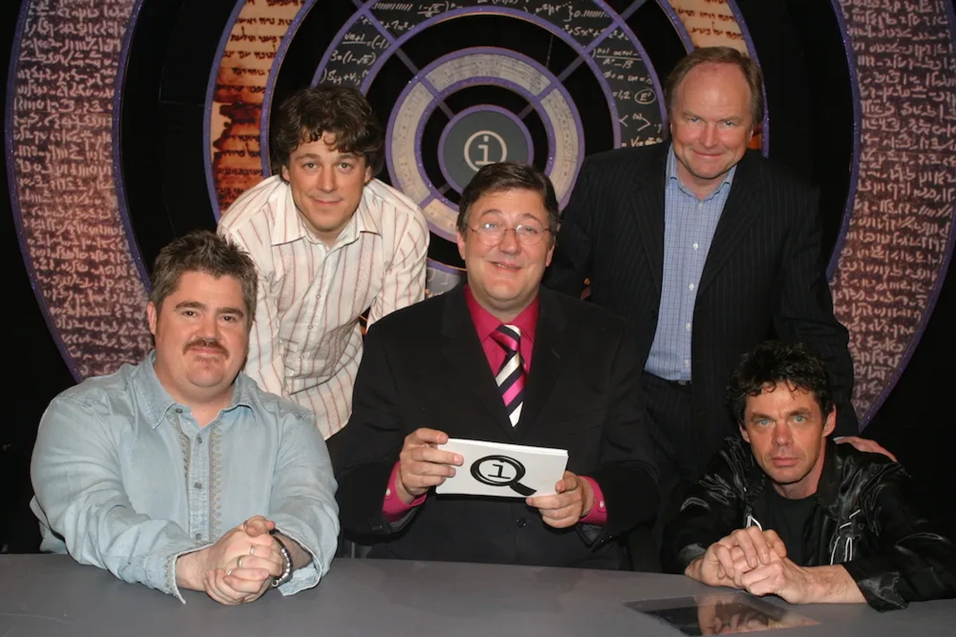 Stephen Fry, Clive Anderson, Alan Davies, Rich Hall, and Phill Jupitus in QI (2003)