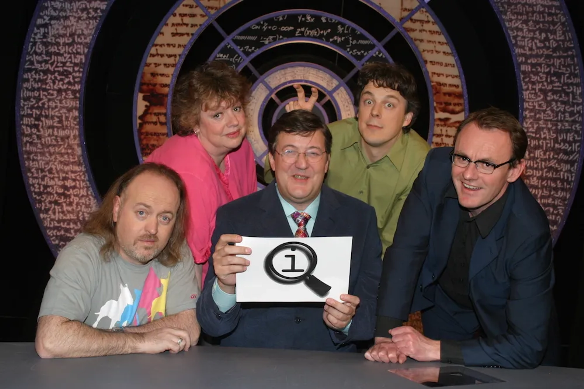 Stephen Fry, Bill Bailey, Jo Brand, Alan Davies, and Sean Lock in QI (2003)