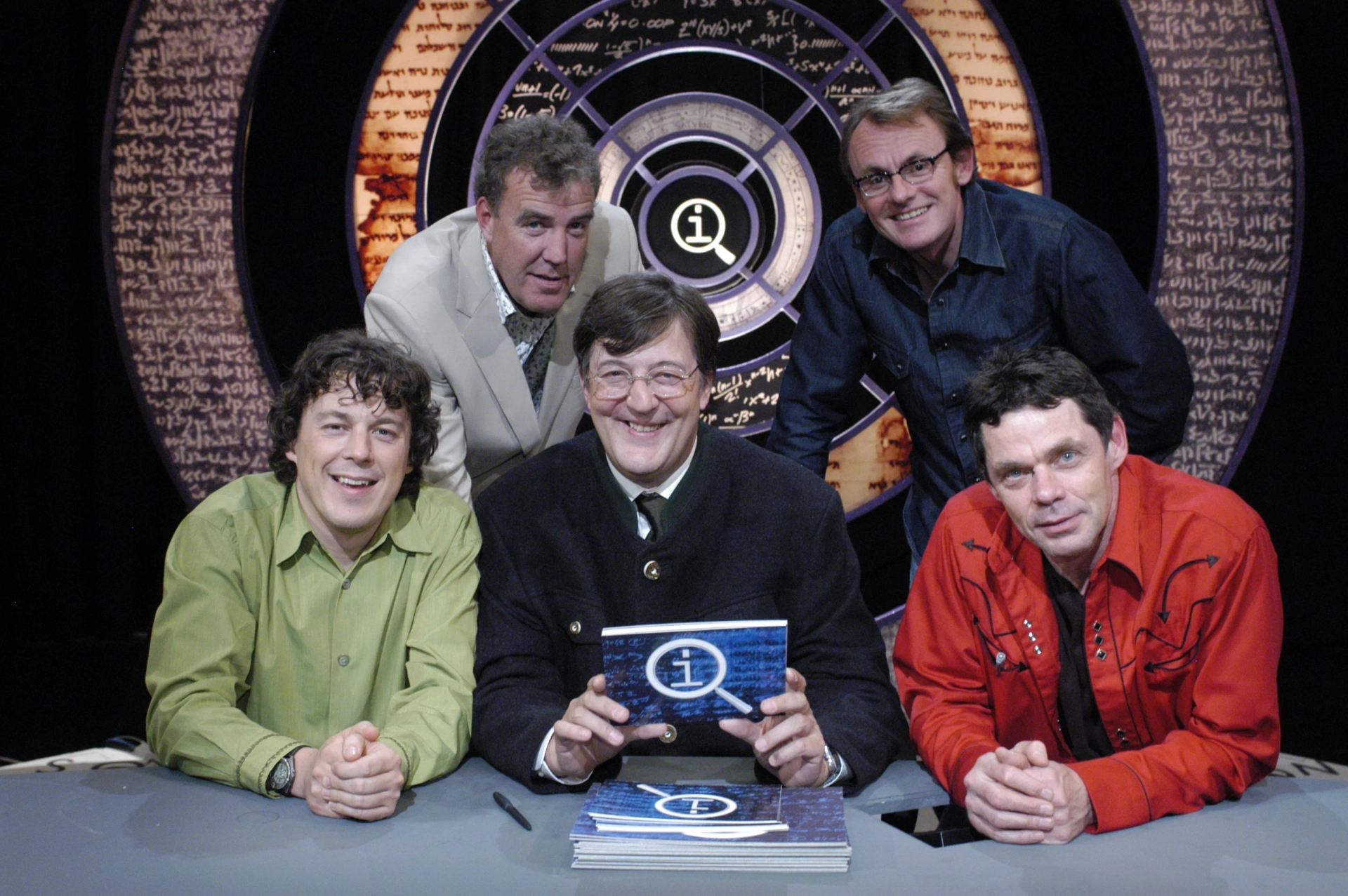 Stephen Fry, Jeremy Clarkson, Alan Davies, Rich Hall, and Sean Lock in QI (2003)