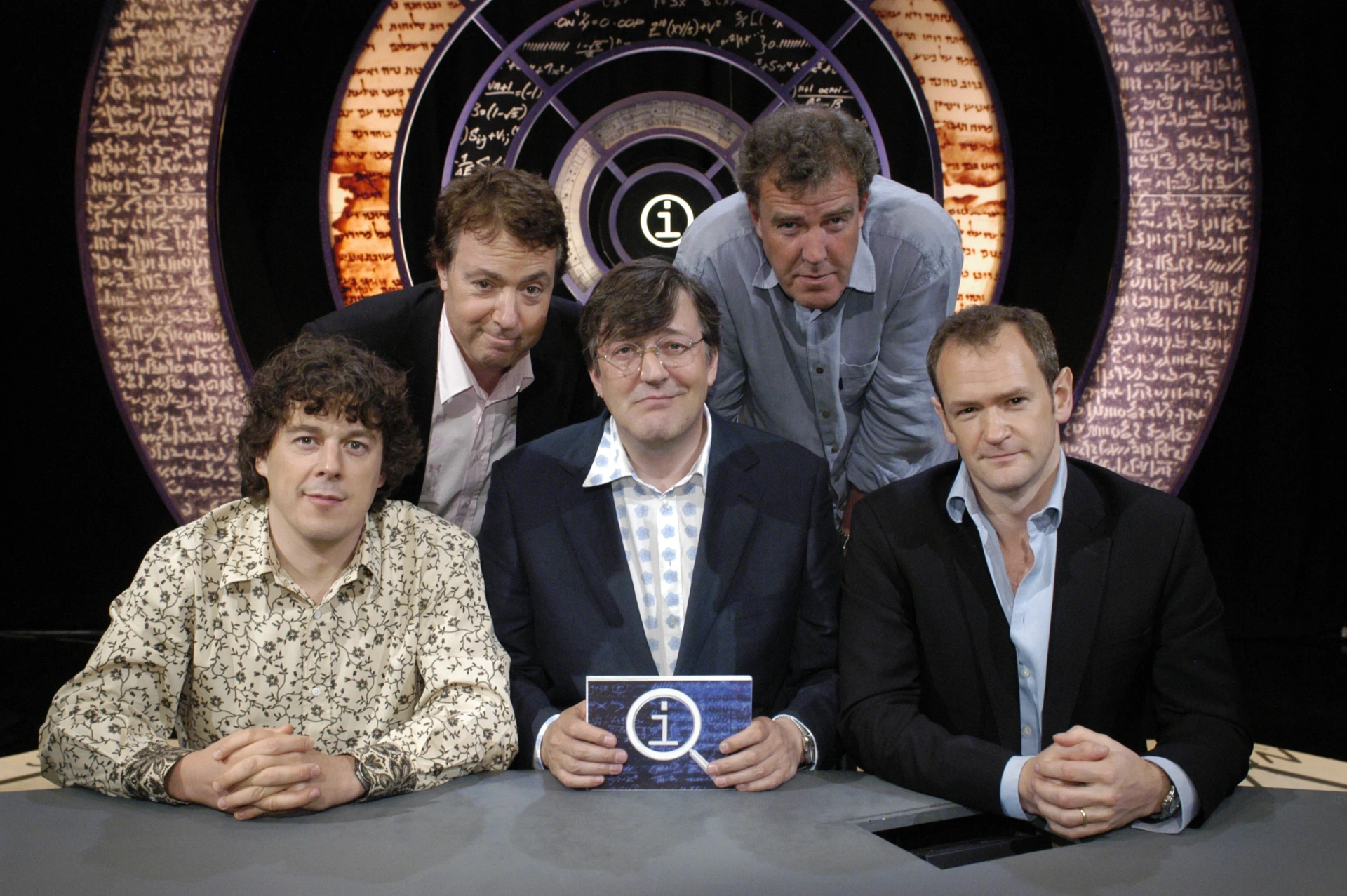 Stephen Fry, Alexander Armstrong, Jeremy Clarkson, Alan Davies, and John Sessions in QI (2003)