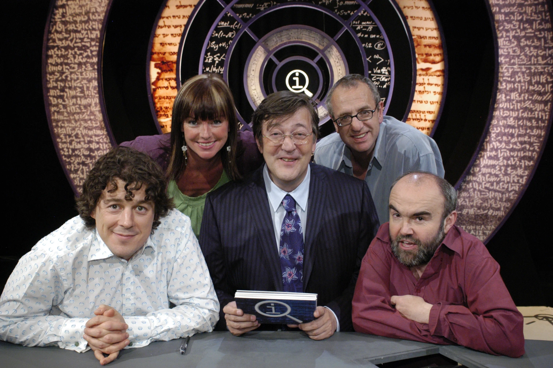 Stephen Fry, Alan Davies, Andy Hamilton, Doon Mackichan, and Arthur Smith in QI (2003)