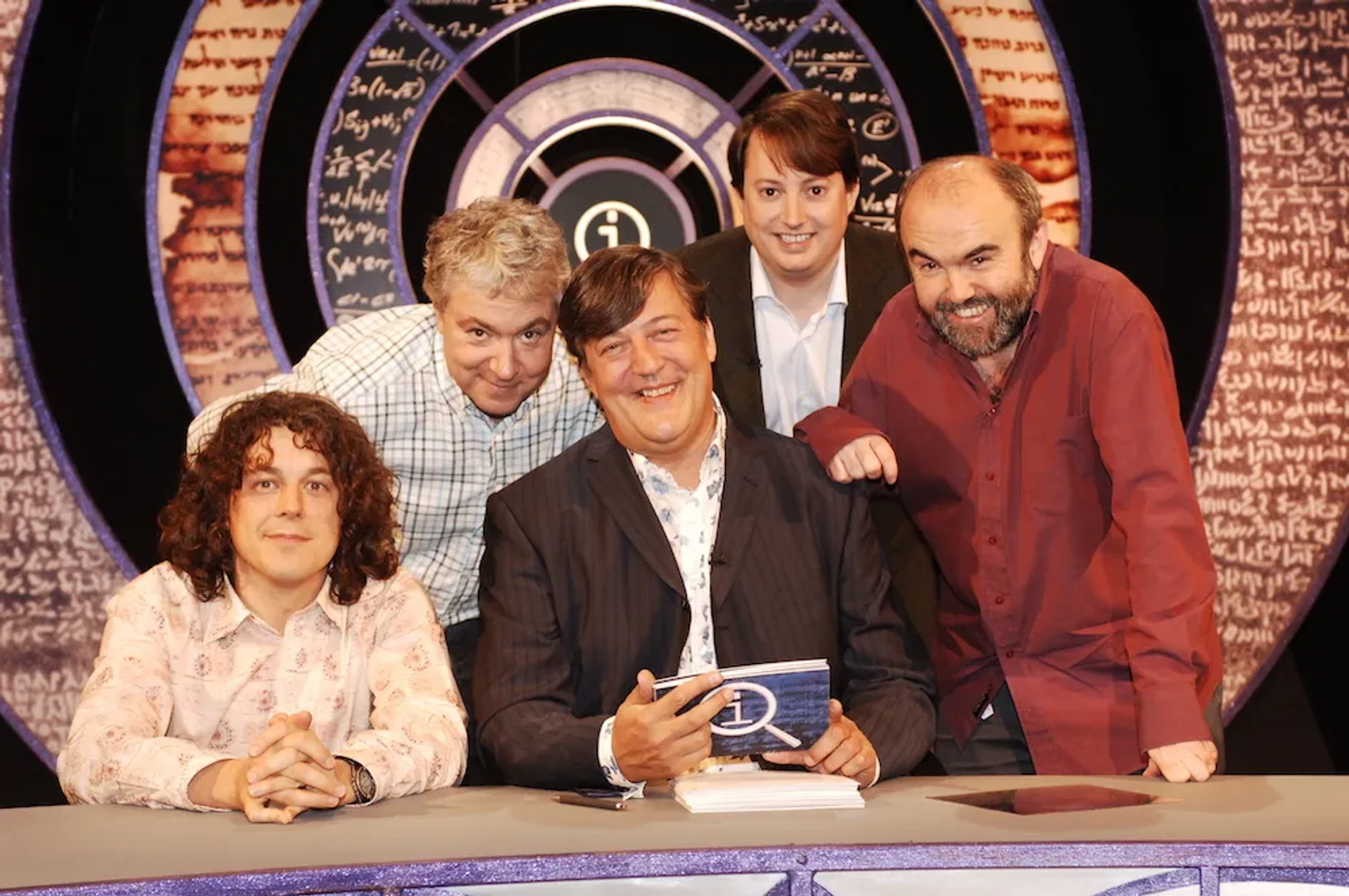 Stephen Fry, Alan Davies, Andy Hamilton, David Mitchell, and John Sessions in QI (2003)