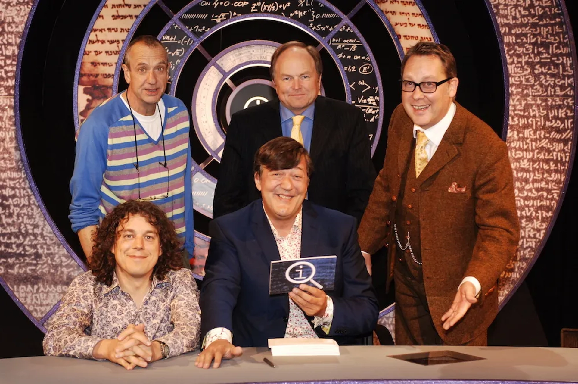 Stephen Fry, Clive Anderson, Alan Davies, Vic Reeves, and Arthur Smith in QI (2003)