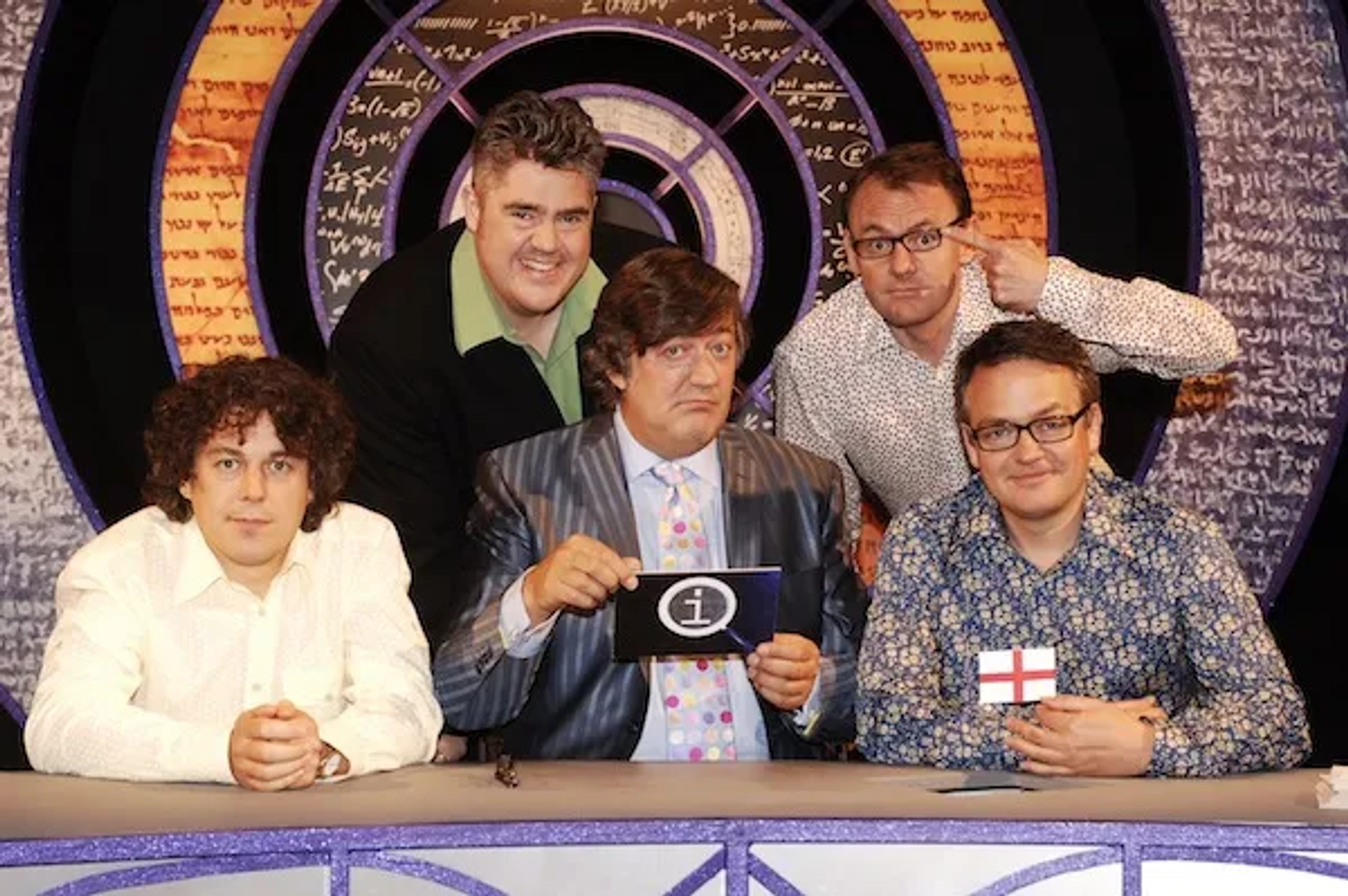 Stephen Fry, Alan Davies, Charlie Higson, Phill Jupitus, and Sean Lock in QI (2003)