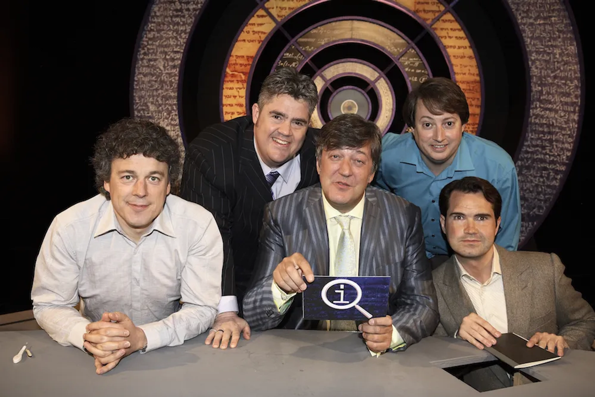 Stephen Fry, Bill Bailey, Jimmy Carr, Alan Davies, and David Mitchell in QI (2003)