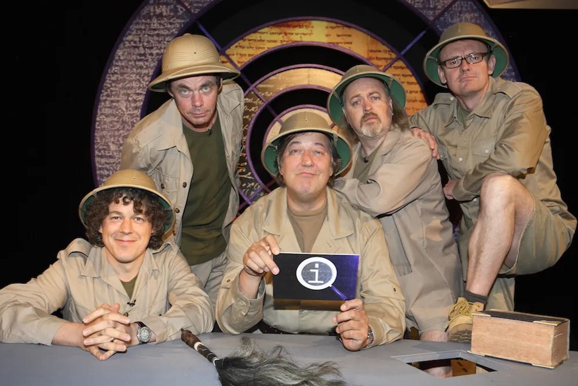 Stephen Fry, Bill Bailey, Alan Davies, Rich Hall, and Sean Lock in QI (2003)