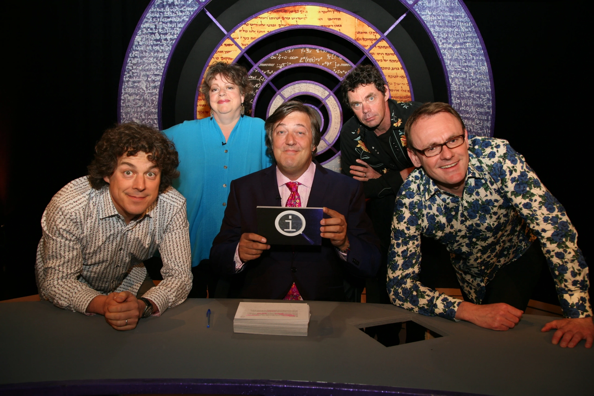 Stephen Fry, Jo Brand, Alan Davies, Rich Hall, and Sean Lock in QI (2003)