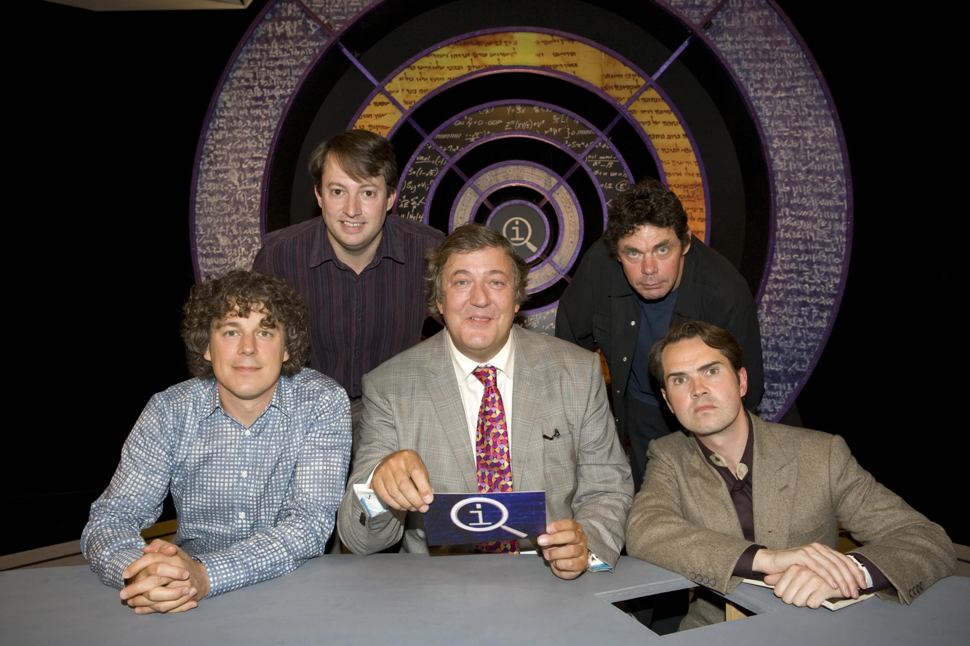 Stephen Fry, Jimmy Carr, Alan Davies, Rich Hall, and David Mitchell in QI (2003)