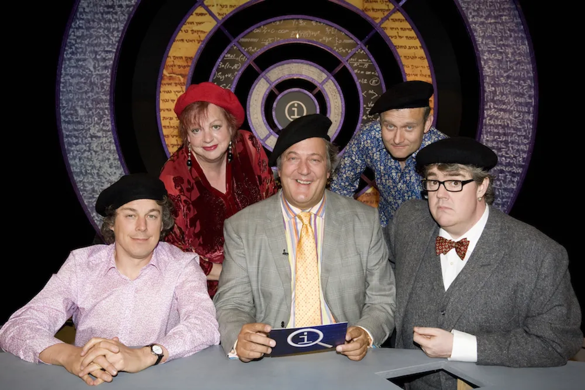 Stephen Fry, Jo Brand, Alan Davies, Hugh Dennis, and Phill Jupitus in QI (2003)