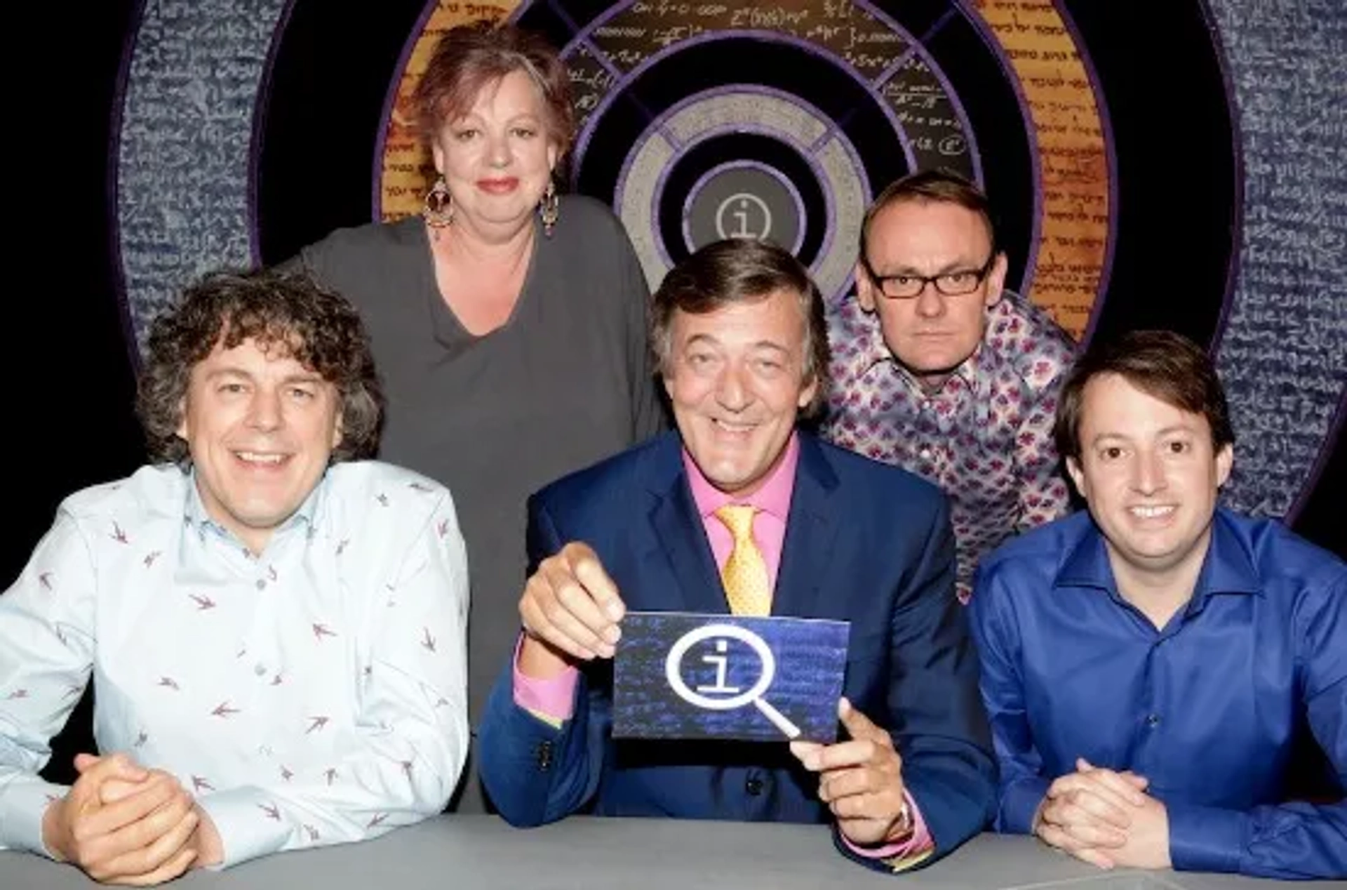 Stephen Fry, Jo Brand, Alan Davies, Sean Lock, and David Mitchell in QI (2003)