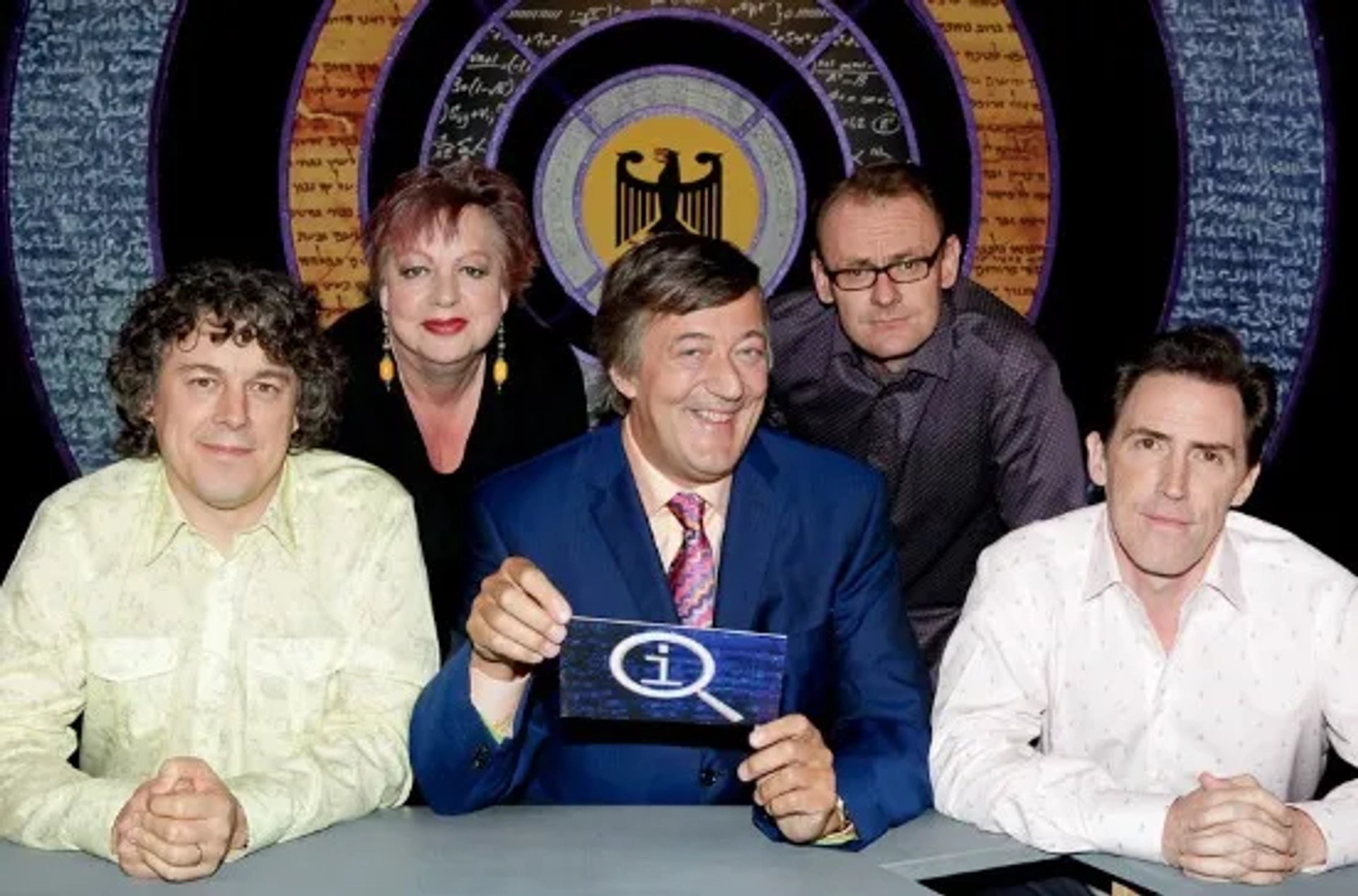 Stephen Fry, Jo Brand, Rob Brydon, Alan Davies, and Sean Lock in QI (2003)