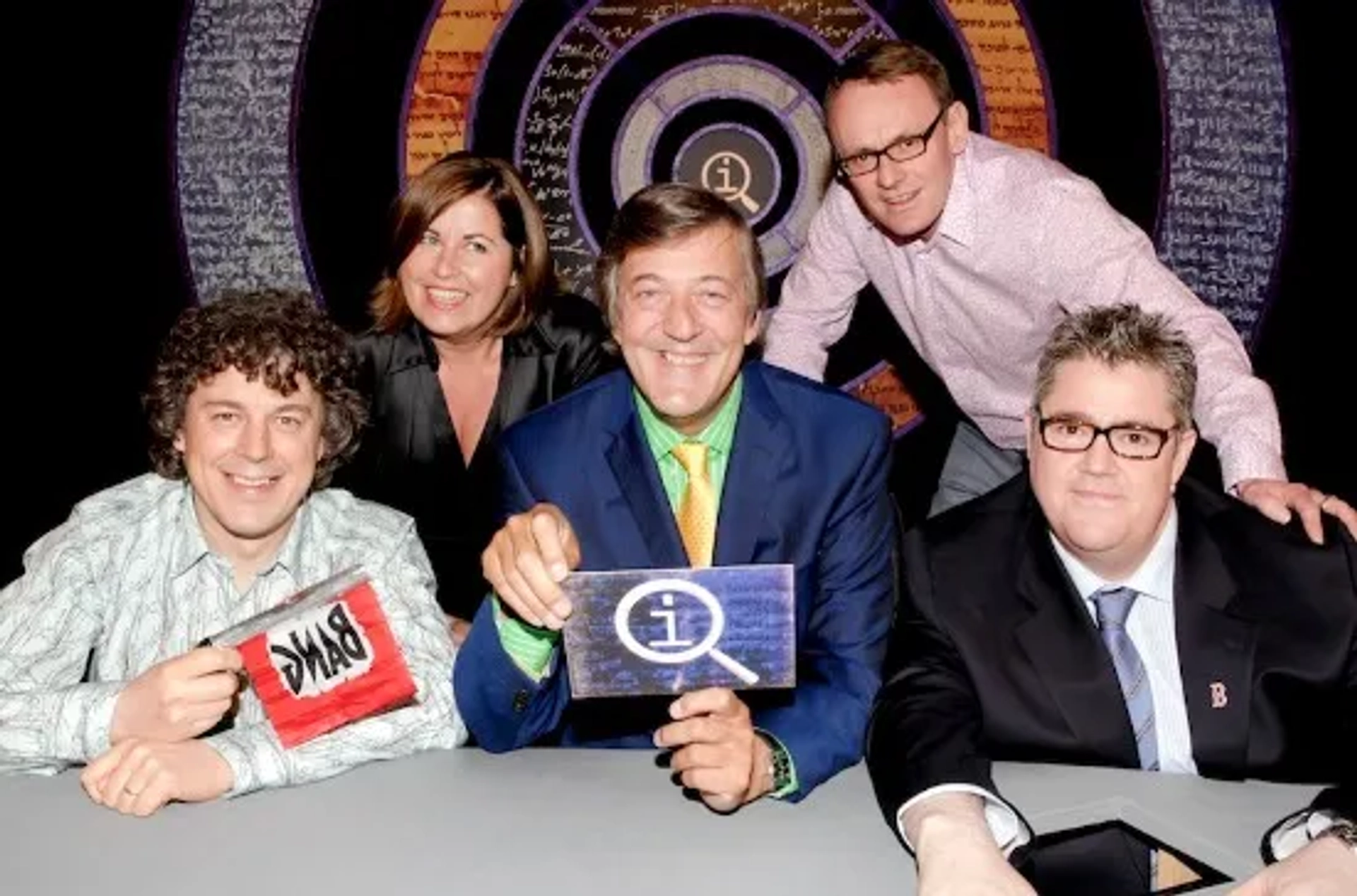 Stephen Fry, Alan Davies, Phill Jupitus, Sean Lock, and Liza Tarbuck in QI (2003)