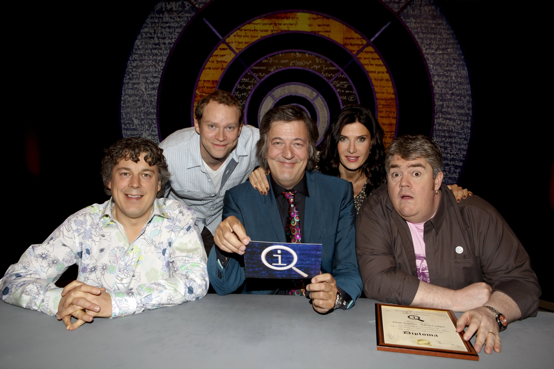 Stephen Fry, Ronni Ancona, Alan Davies, Phill Jupitus, and Robert Webb in QI (2003)