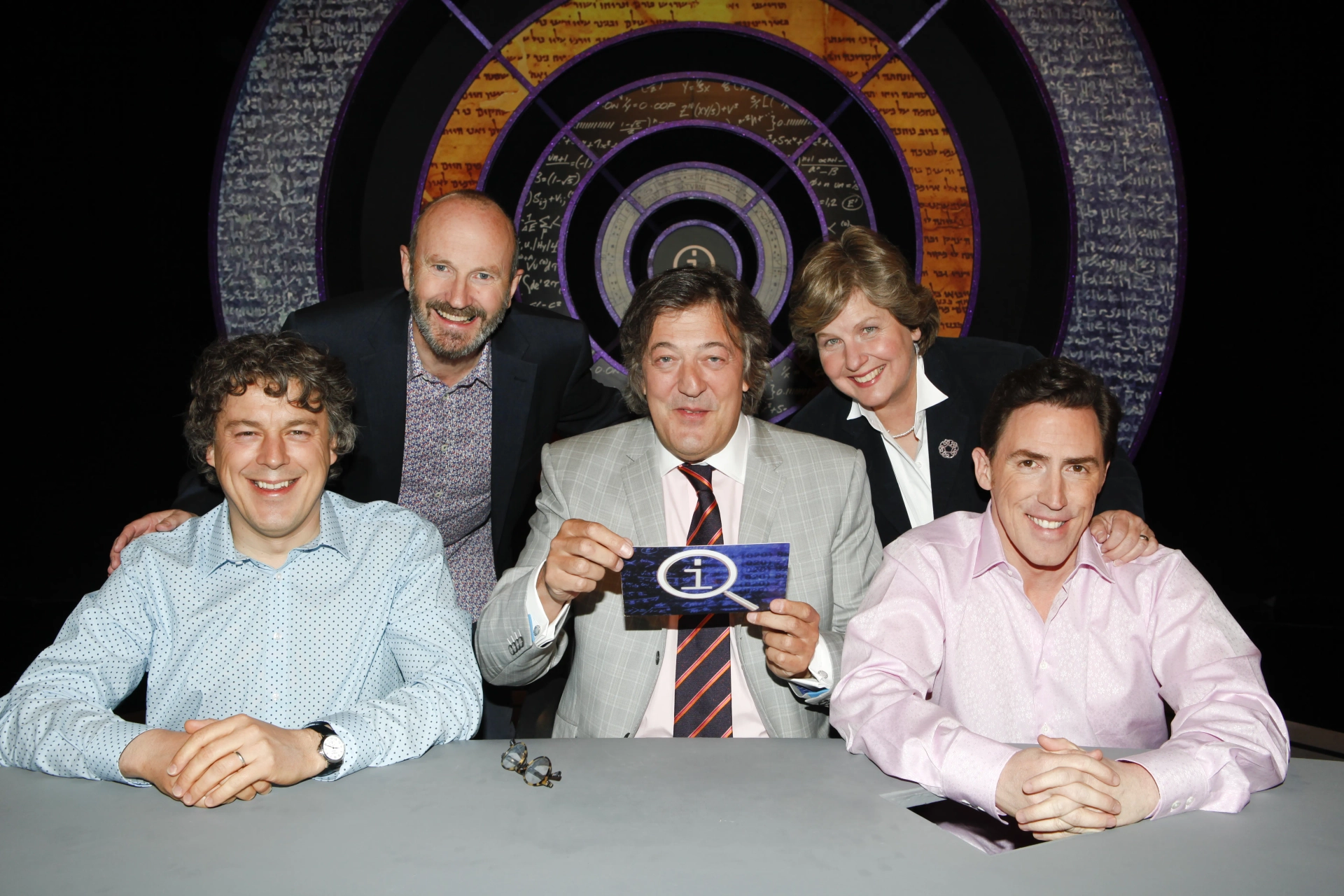 Stephen Fry, Rob Brydon, Alan Davies, Fred MacAulay, and Sandi Toksvig in QI (2003)