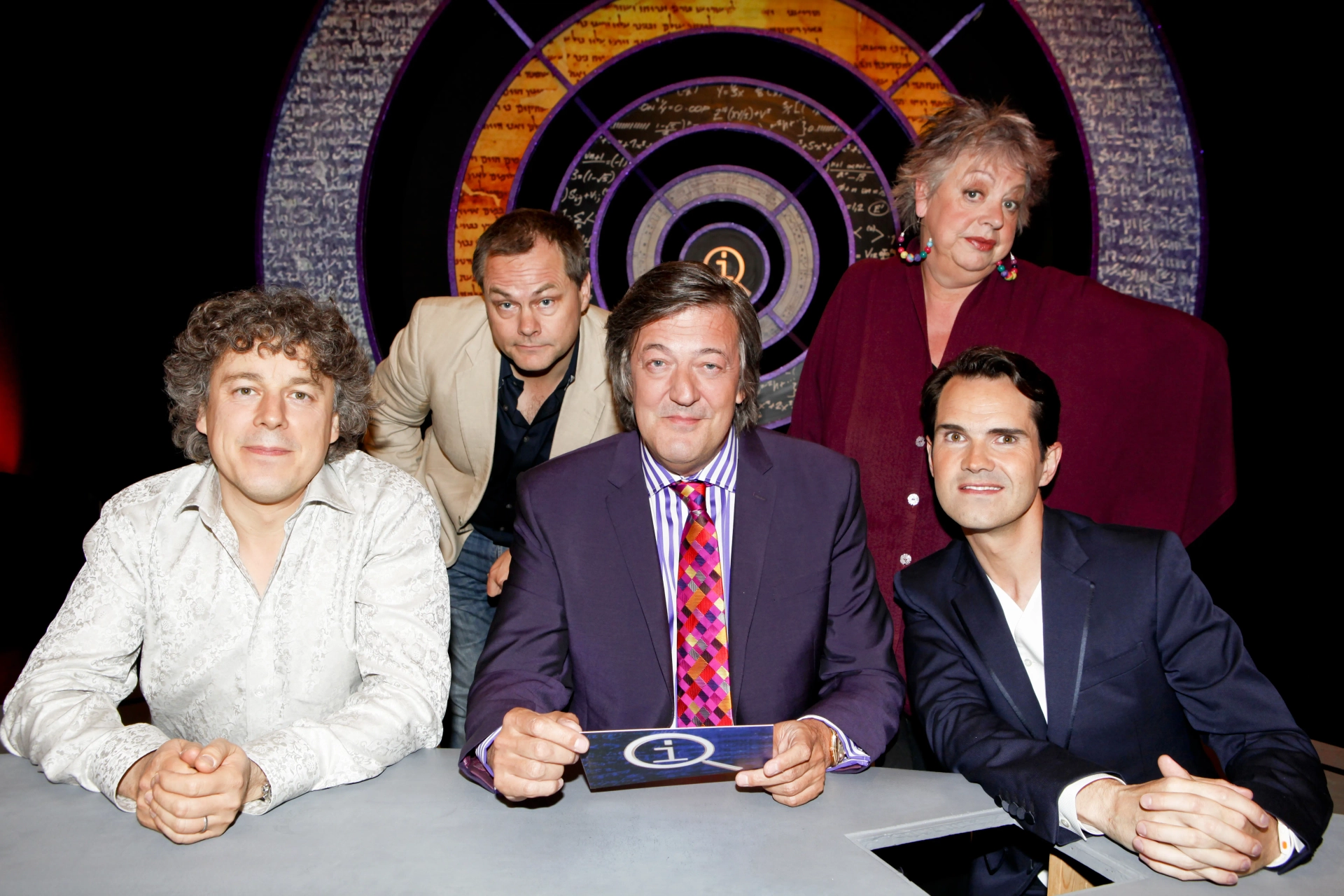 Stephen Fry, Jo Brand, Jimmy Carr, Alan Davies, and Jack Dee in QI (2003)