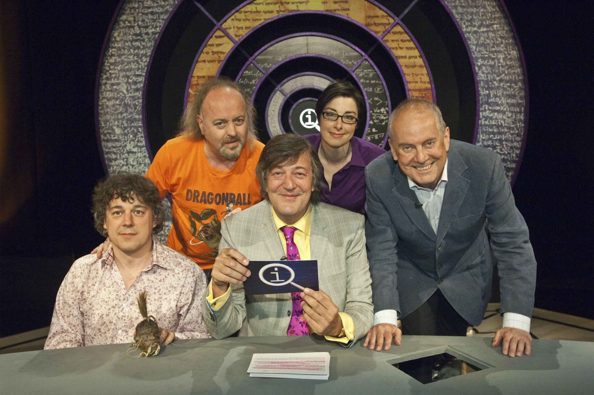 Stephen Fry, Bill Bailey, Alan Davies, Sue Perkins, and Gyles Brandreth in QI (2003)