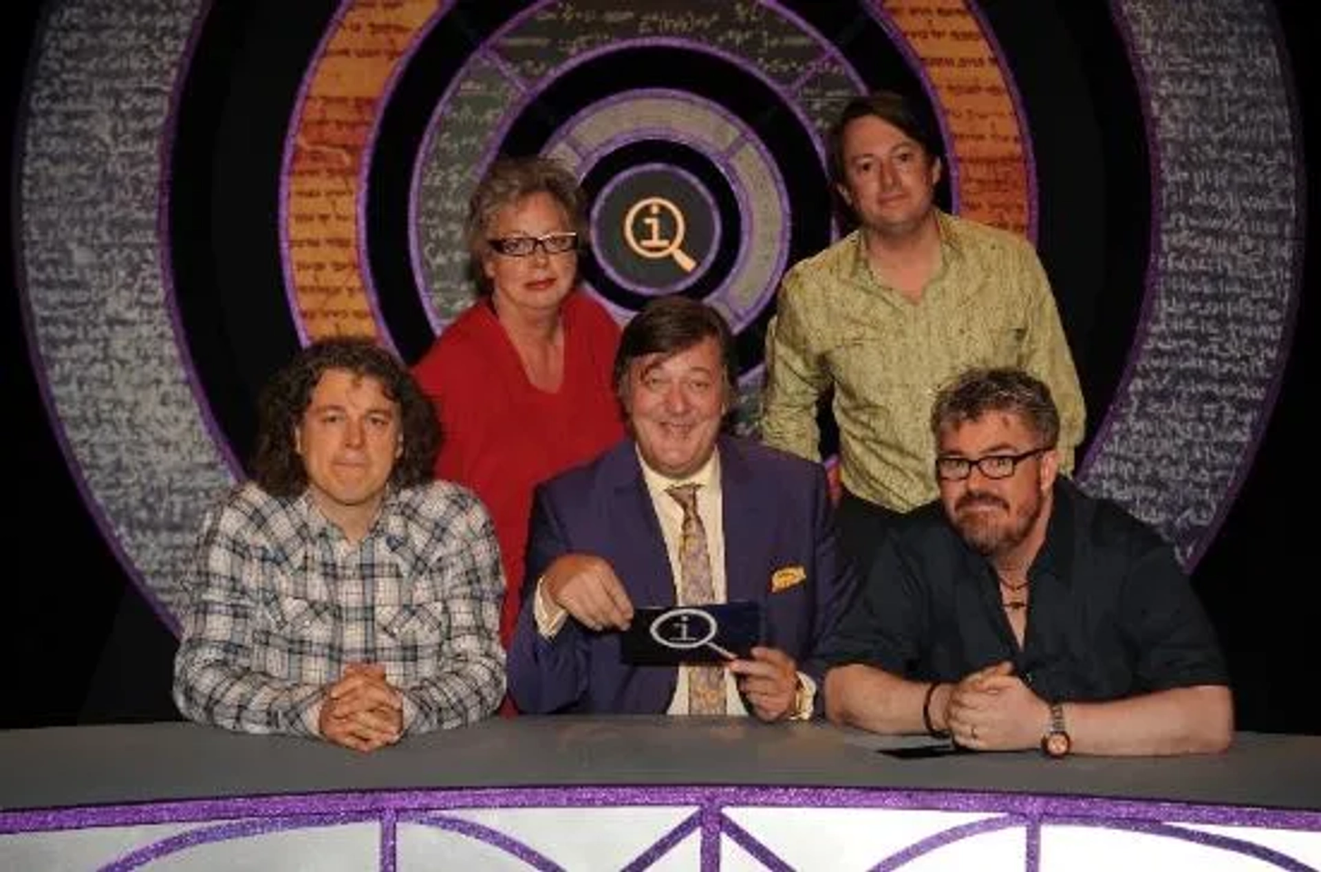 Stephen Fry, Jo Brand, Alan Davies, Phill Jupitus, and David Mitchell in QI (2003)