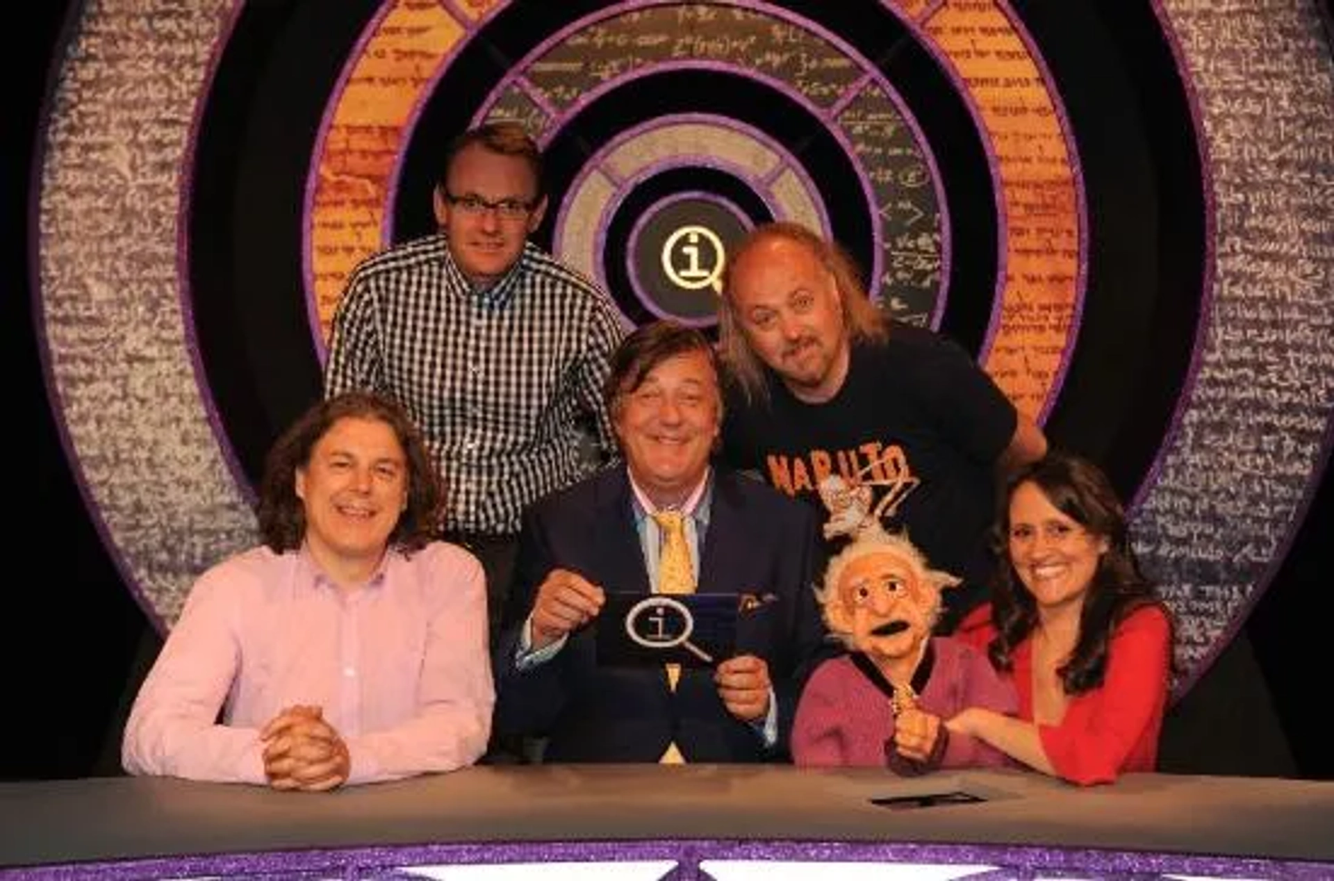 Stephen Fry, Bill Bailey, Nina Conti, Alan Davies, and Sean Lock in QI (2003)