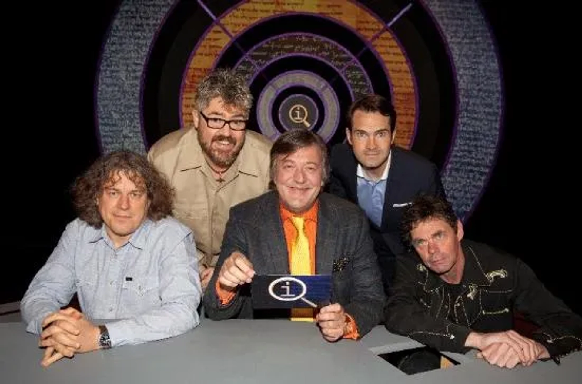 Stephen Fry, Jimmy Carr, Alan Davies, Rich Hall, and Phill Jupitus in QI (2003)