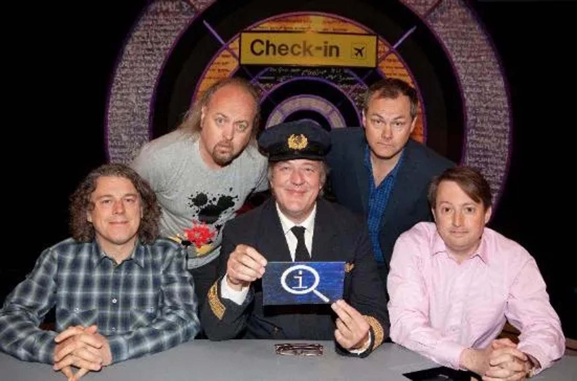 Stephen Fry, Bill Bailey, Alan Davies, Jack Dee, and David Mitchell in QI (2003)