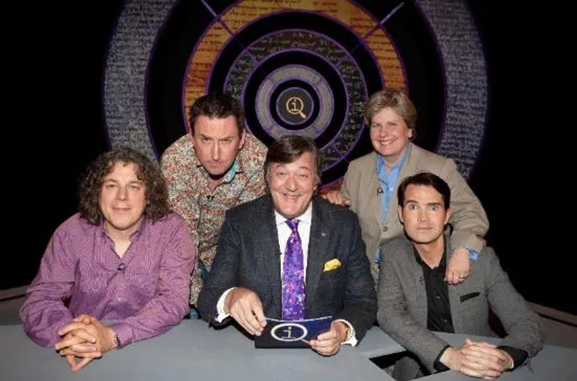 Stephen Fry, Jimmy Carr, Alan Davies, Sandi Toksvig, and Lee Mack in QI (2003)