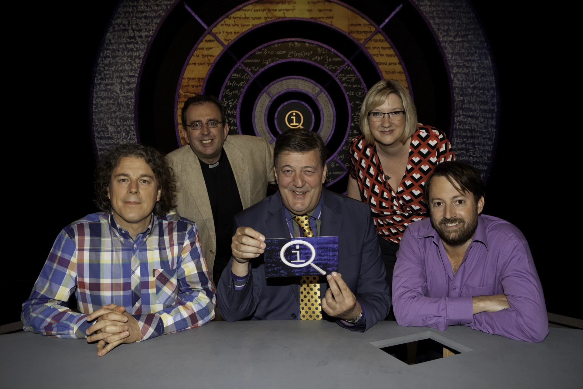 Stephen Fry, Alan Davies, David Mitchell, Richard Coles, and Sarah Millican in QI (2003)