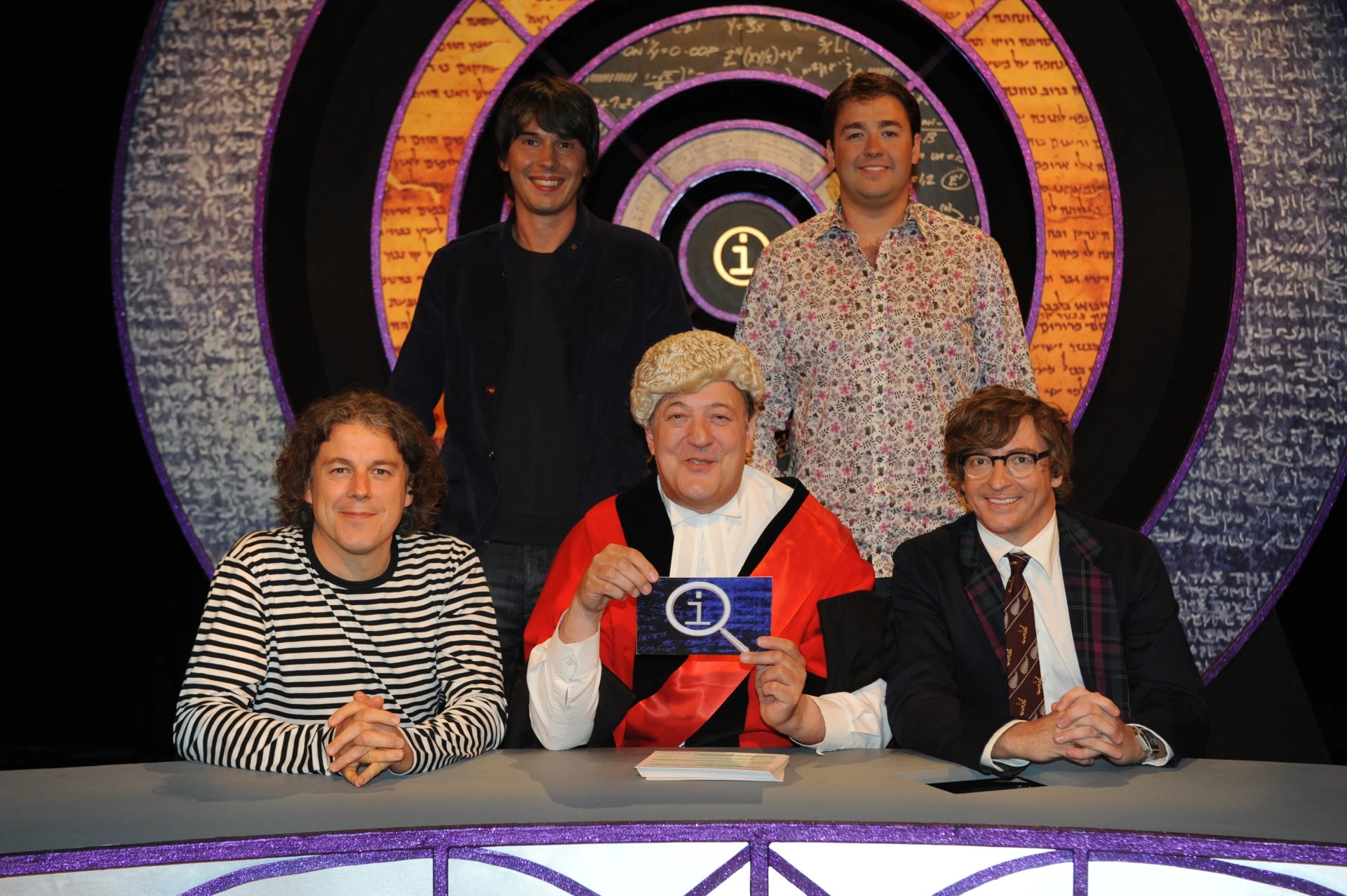 Stephen Fry, Alan Davies, Rhys Darby, Jason Manford, and Brian Cox in QI (2003)