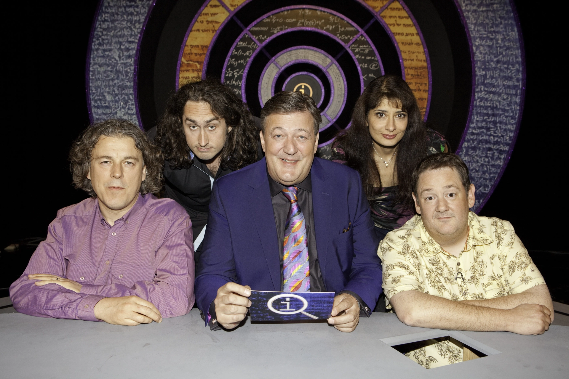 Stephen Fry, Alan Davies, Ross Noble, Johnny Vegas, and Shaparak Khorsandi in QI (2003)