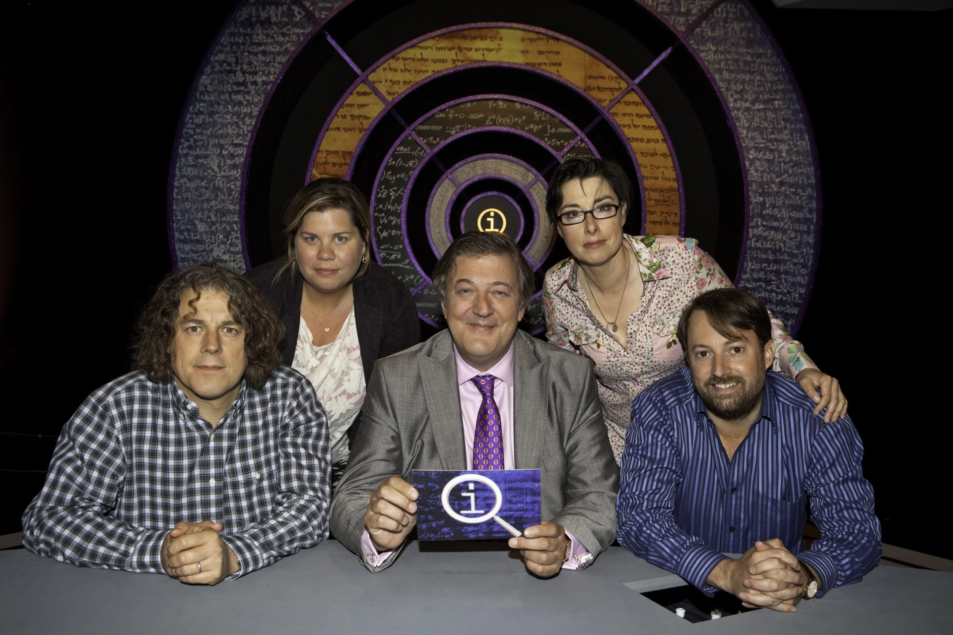 Stephen Fry, Alan Davies, David Mitchell, Sue Perkins, and Katy Brand in QI (2003)