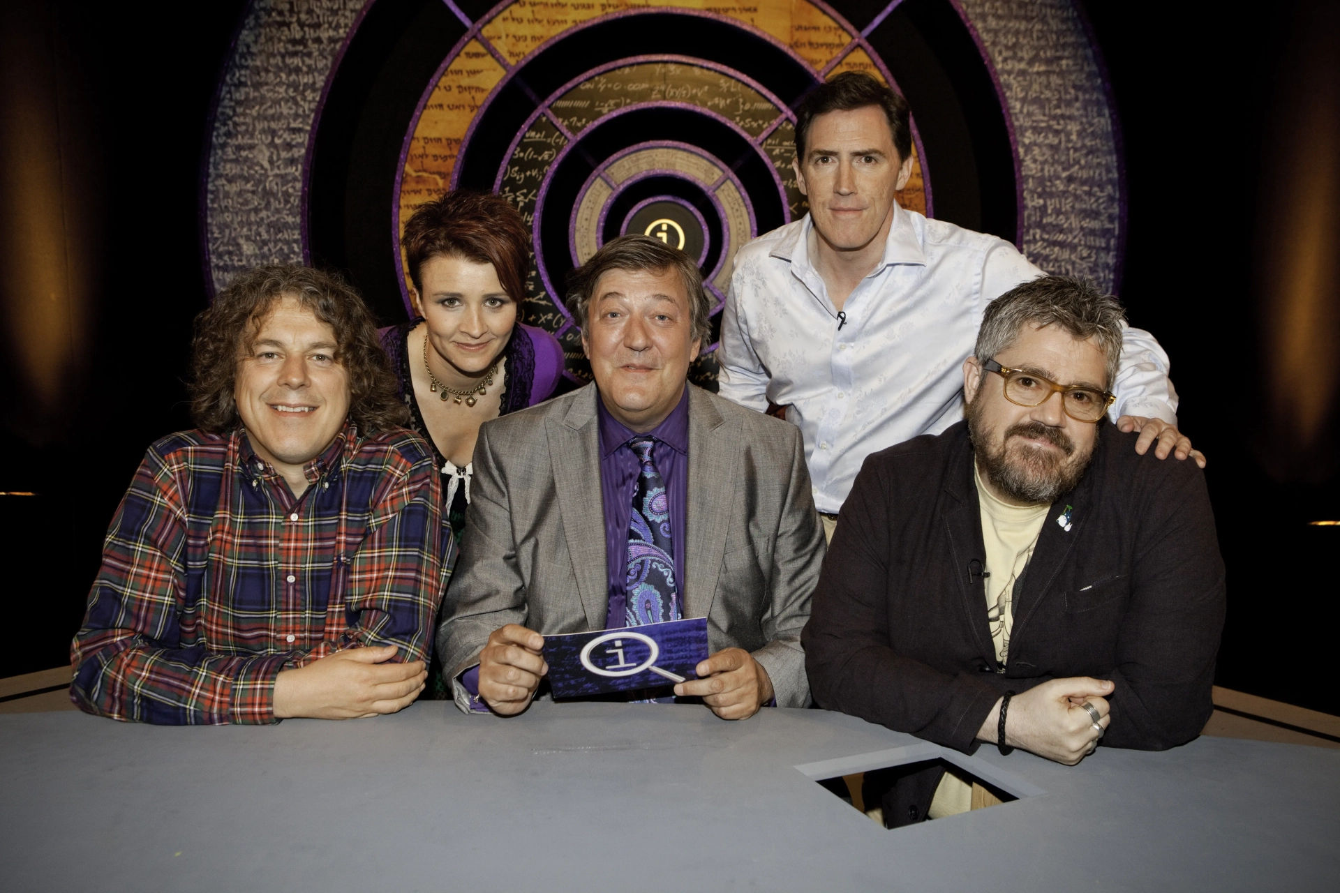 Stephen Fry, Rob Brydon, Alan Davies, Phill Jupitus, and Cal Wilson in QI (2003)