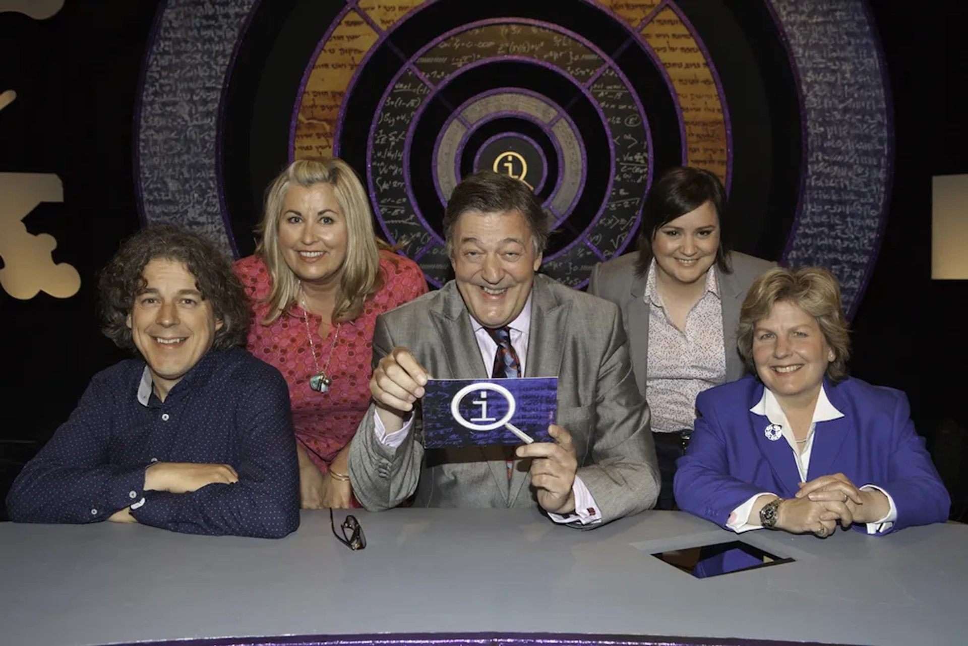 Stephen Fry, Alan Davies, Liza Tarbuck, Sandi Toksvig, and Susan Calman in QI (2003)