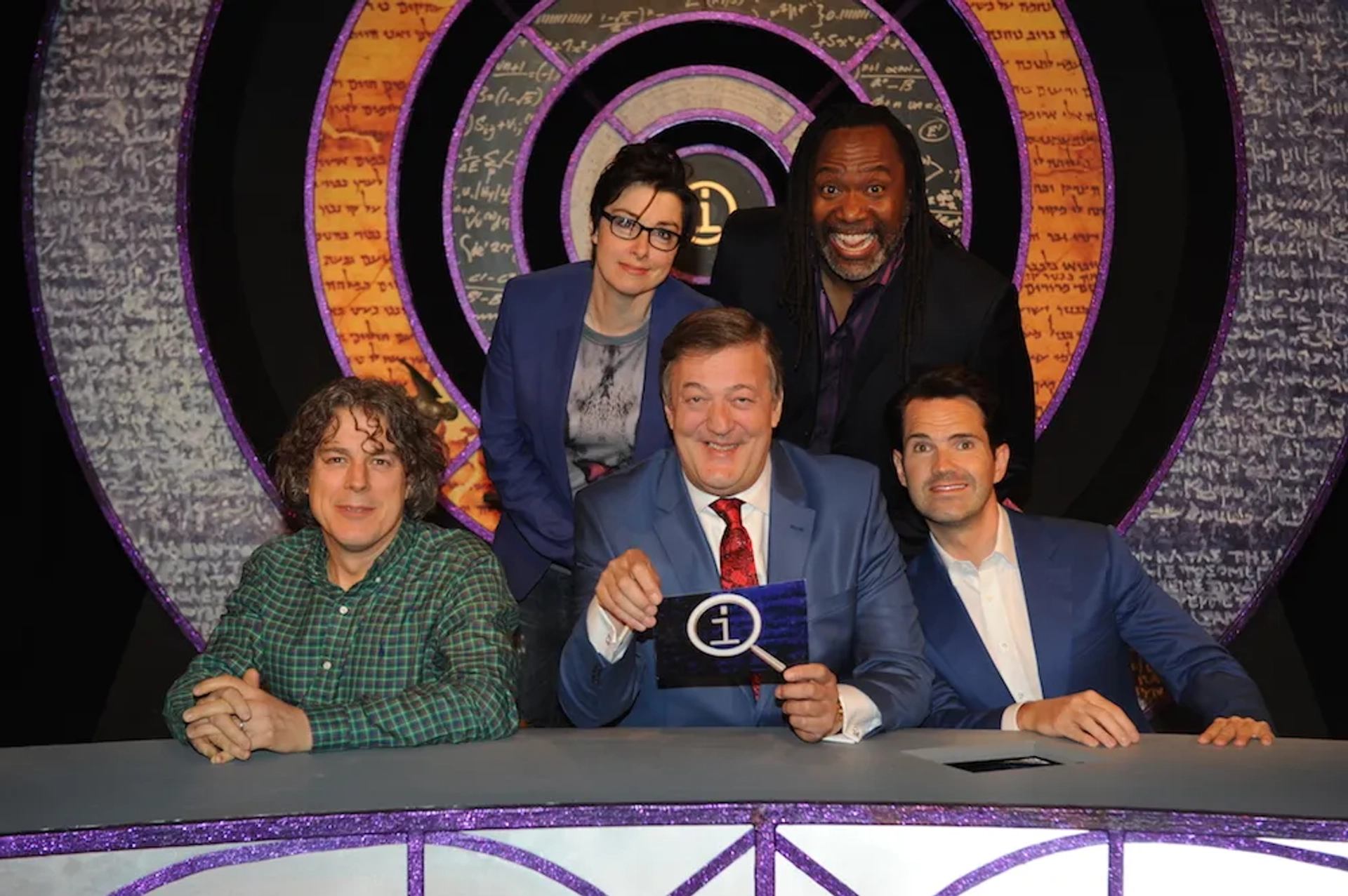 Stephen Fry, Jimmy Carr, Alan Davies, Sue Perkins, and Reginald D. Hunter in QI (2003)