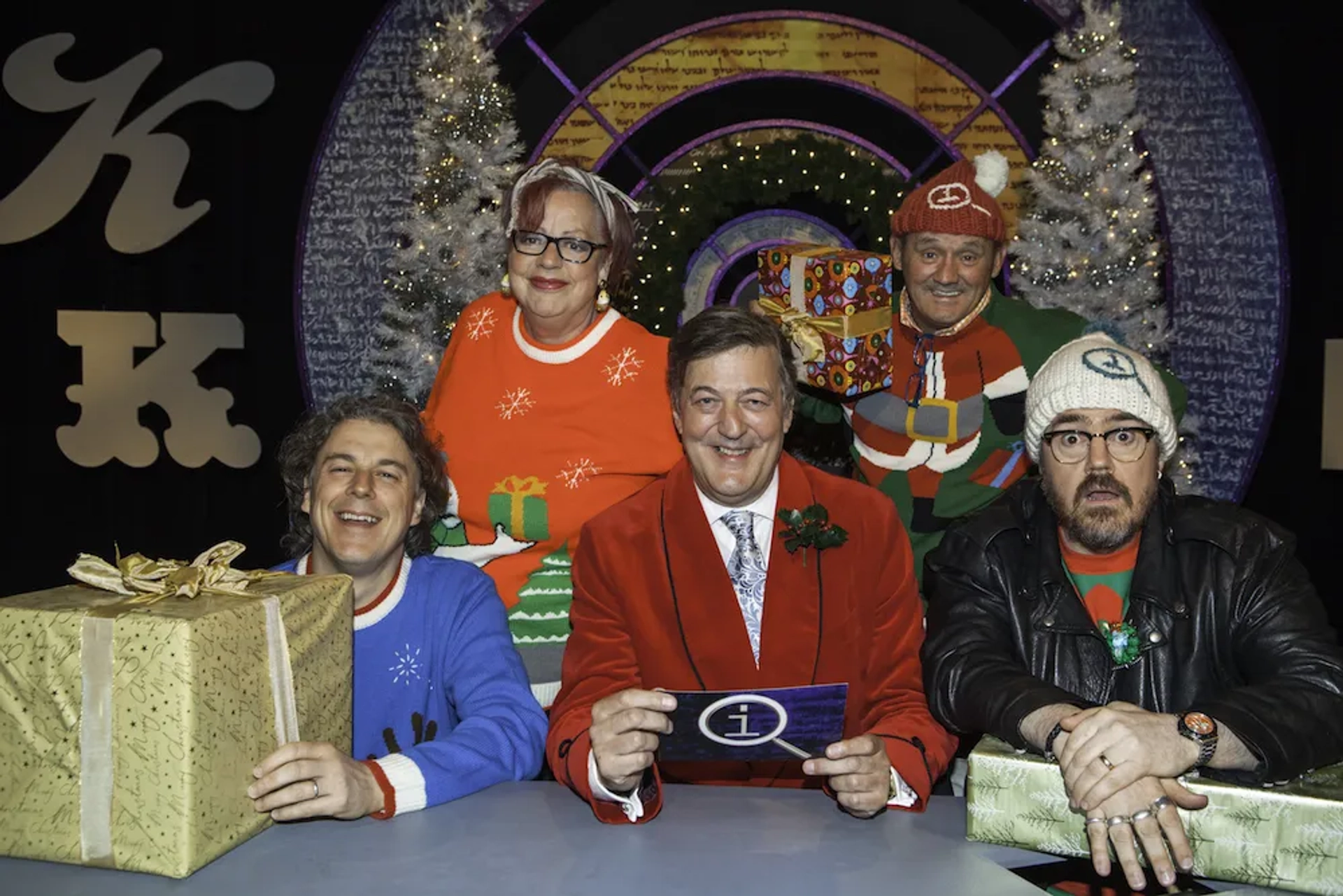 Stephen Fry, Jo Brand, Alan Davies, Phill Jupitus, and Brendan O'Carroll in QI (2003)