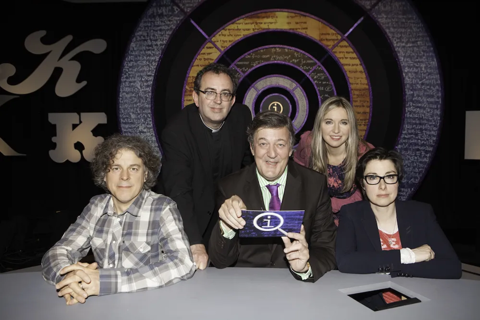 Stephen Fry, Alan Davies, Sue Perkins, Victoria Coren Mitchell, and Richard Coles in QI (2003)