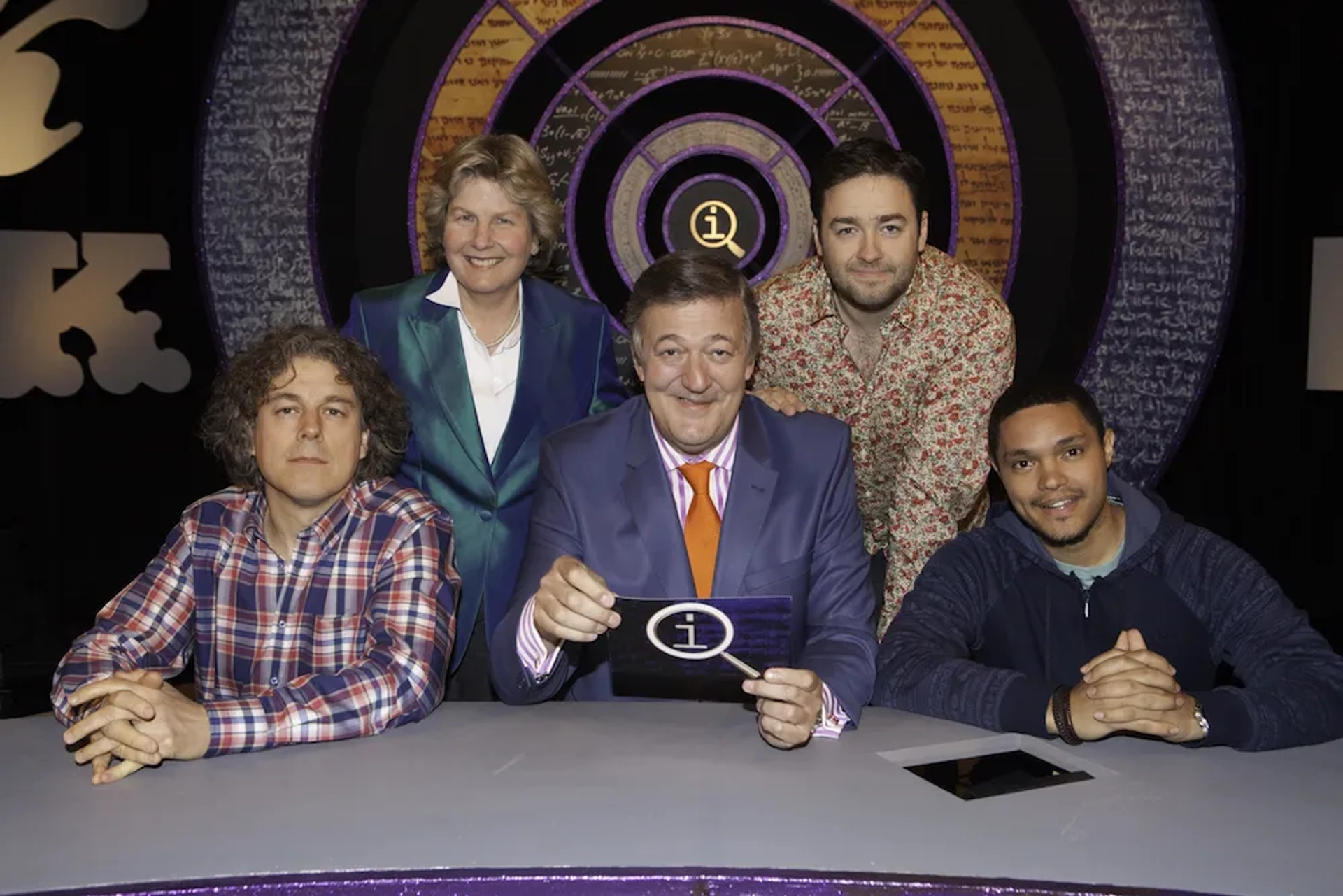 Stephen Fry, Alan Davies, Sandi Toksvig, Jason Manford, and Trevor Noah in QI (2003)