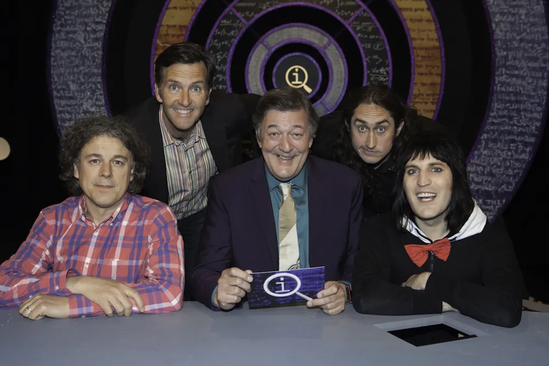 Stephen Fry, Alan Davies, Noel Fielding, Colin Lane, and Ross Noble in QI (2003)