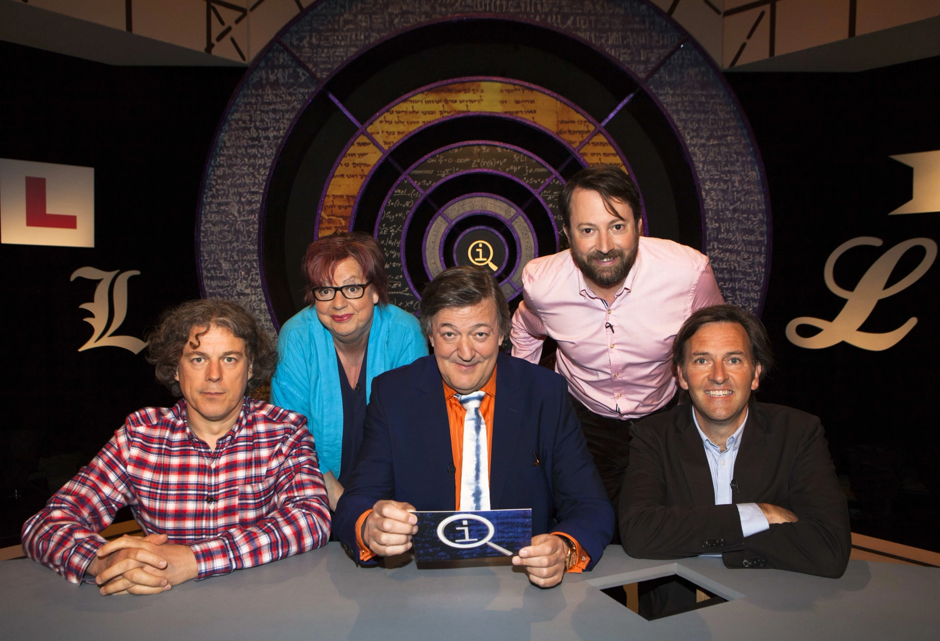 Stephen Fry, Jo Brand, Alan Davies, Colin Lane, and David Mitchell in QI (2003)