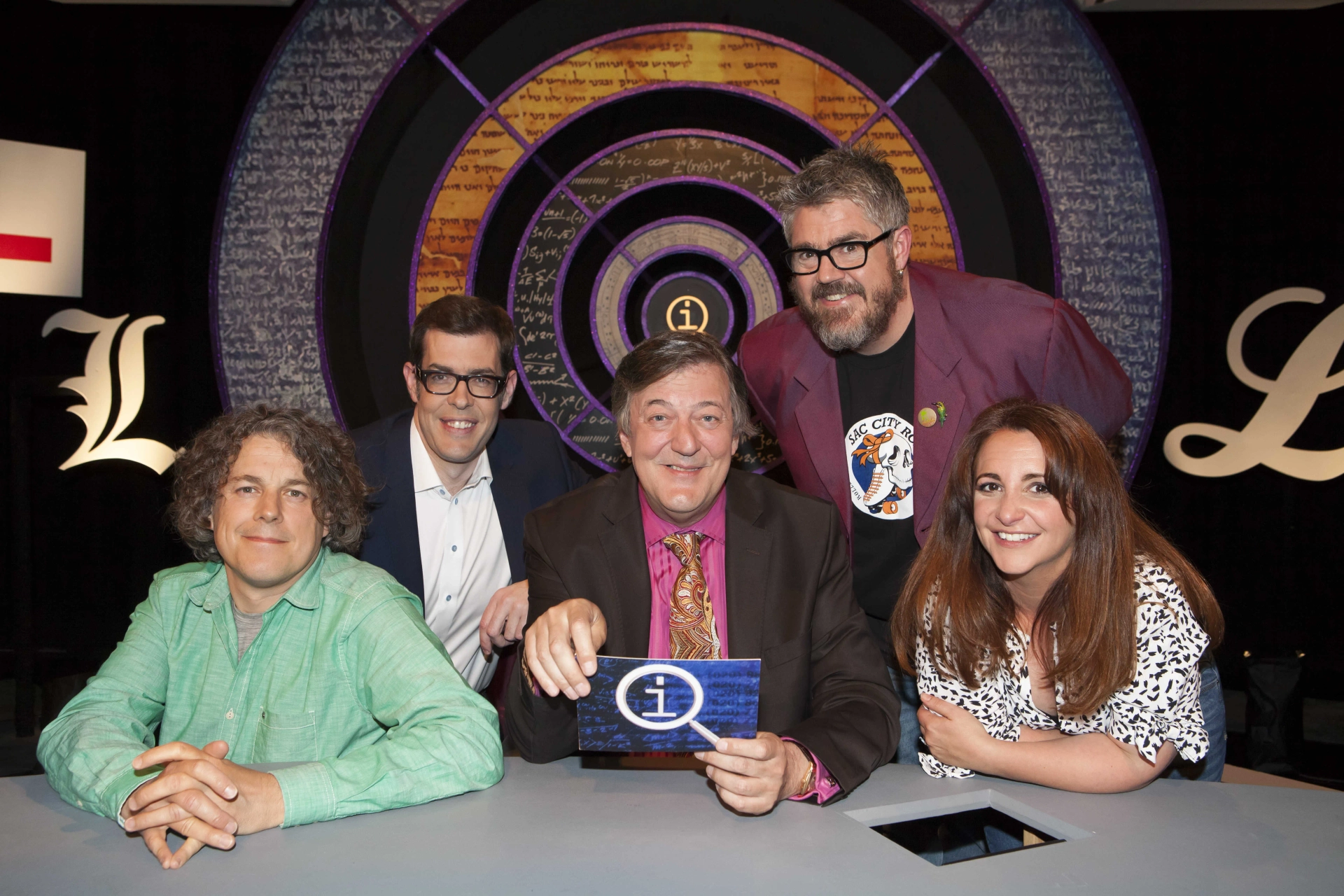 Stephen Fry, Alan Davies, Phill Jupitus, Richard Osman, and Lucy Porter in QI (2003)